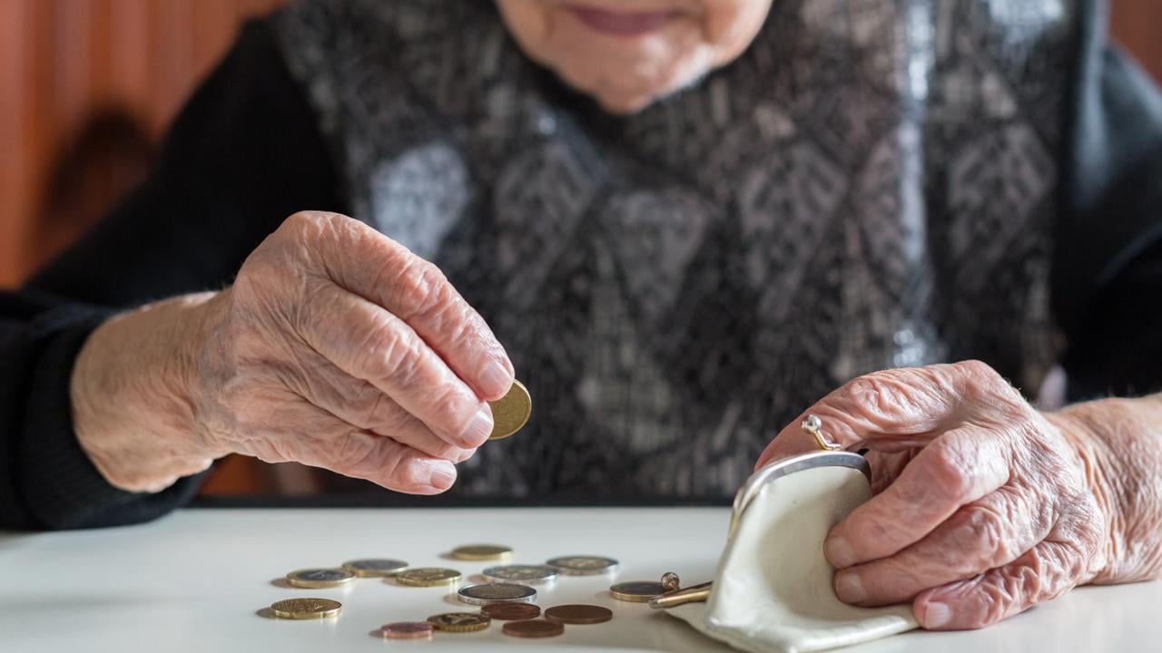 Elderly,95,Years,Old,Woman,Sitting,Miserably,At,The,Table