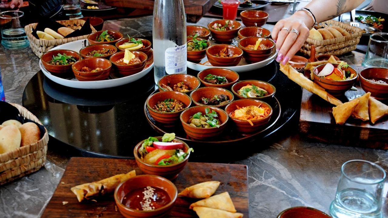 MARRAKESH, MOROCCO - June 2, 2024. Culinary flavors of Morocco and Marrakech. Dishes served on the roof of the elegant restaurant "Le Douar" (open from December 2021). 