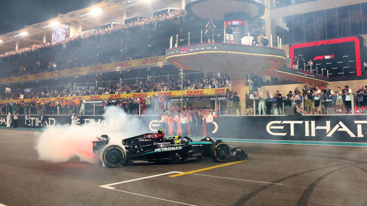 ABU DHABI, UNITED ARAB EMIRATES - DECEMBER 08: 4th placed Lewis Hamilton of Great Britain driving the (44) Mercedes AMG Petronas F1 Team W15 does donuts on track to celebrate his final race with Mercedes during the F1 Grand Prix of Abu Dhabi at Yas Marina Circuit on December 08, 2024 in Abu Dhabi, United Arab Emirates. (Photo by Joe Portlock/Getty Images)