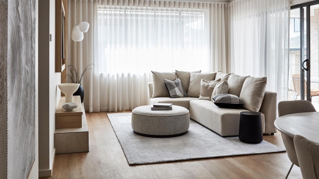 Interior photography of neutral toned lounge room in a modern style family home.