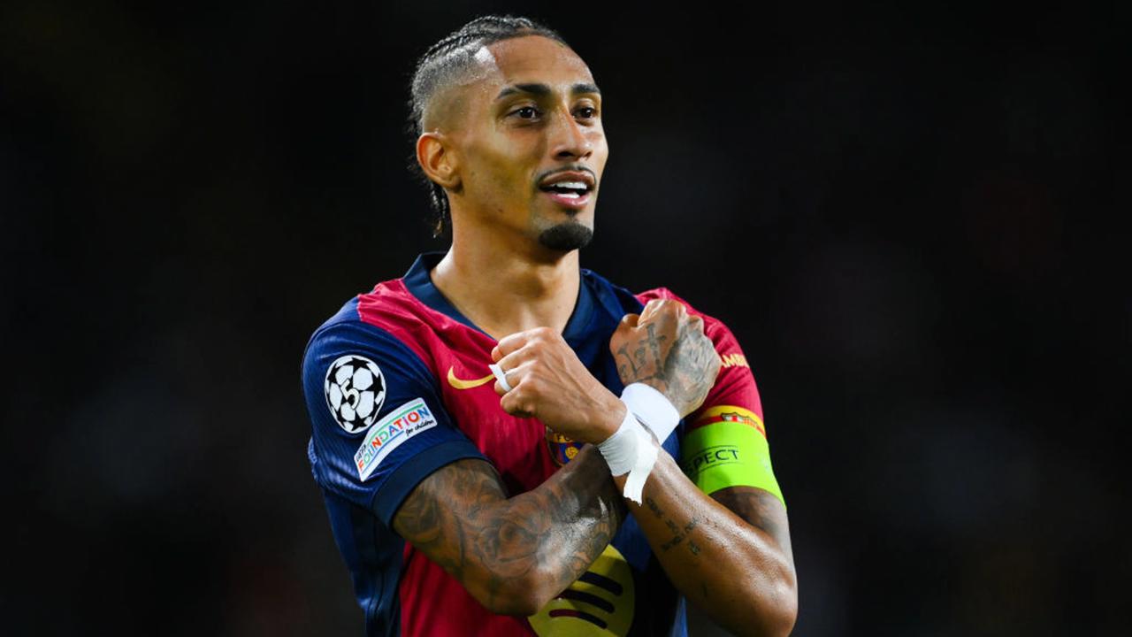 BARCELONA, SPAIN - OCTOBER 23:  Raphinha of FC Barcelona celebrates scoring his team's third goal during the UEFA Champions League 2024/25 League Phase MD3 match between FC Barcelona and FC Bayern Munchen at Estadi Olimpic Lluis Companys on October 23, 2024 in Barcelona, Spain. (Photo by David Ramos/Getty Images)