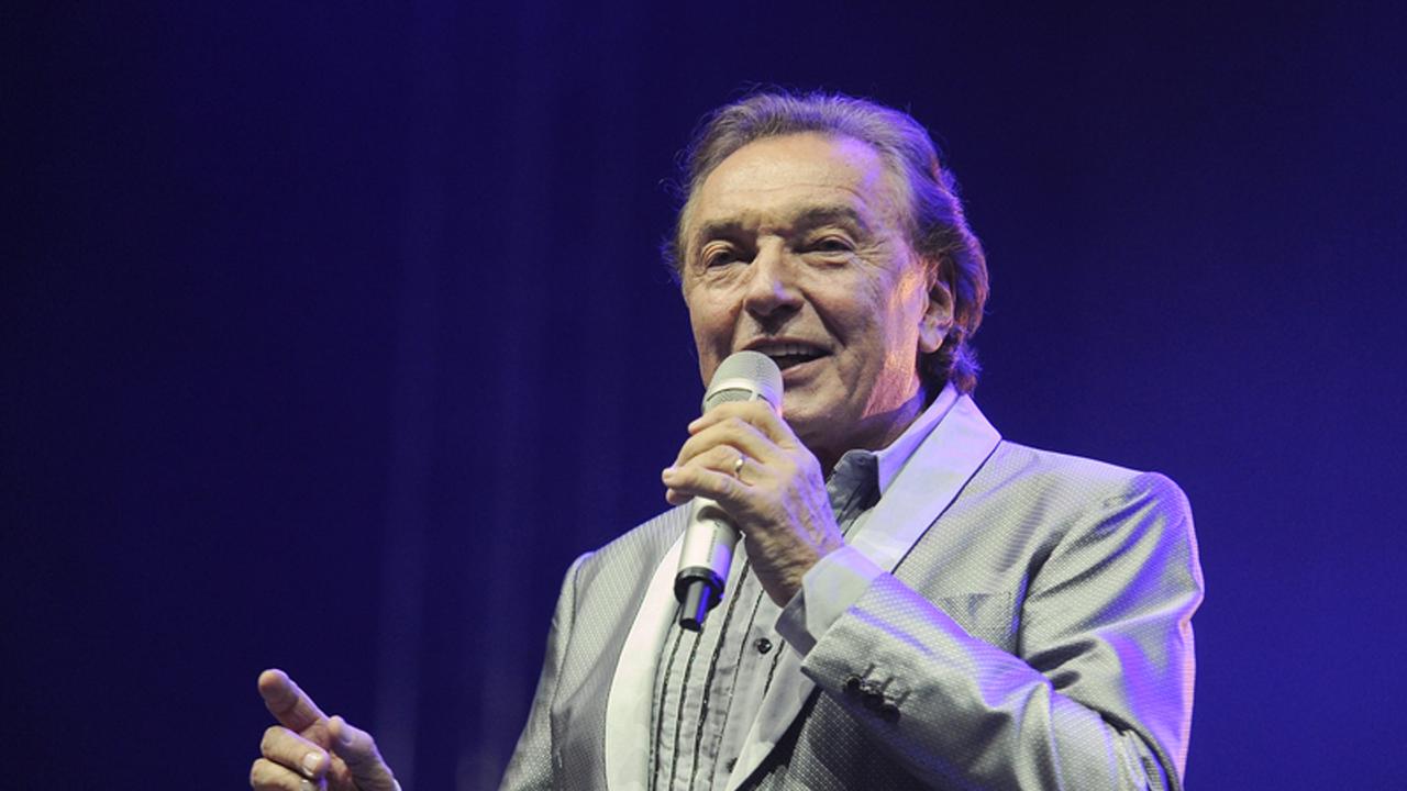 HRADEC KRALOVE - JULY 4: Czech popular singer Karel Gott during his performance at festival Rock for People in Hradec Kralove, Czech republic, July 4, 2013.