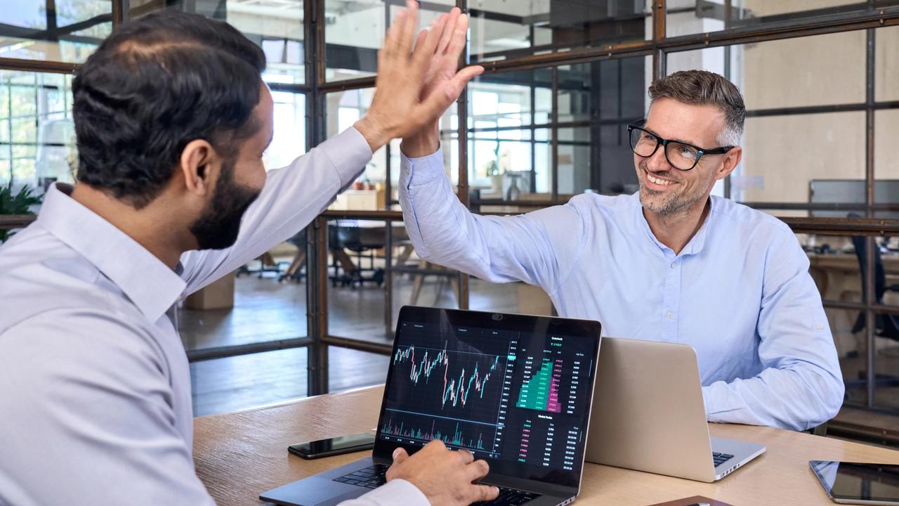 Two,Happy,Successful,Excited,Diverse,Traders,Investors,Giving,High,Five
