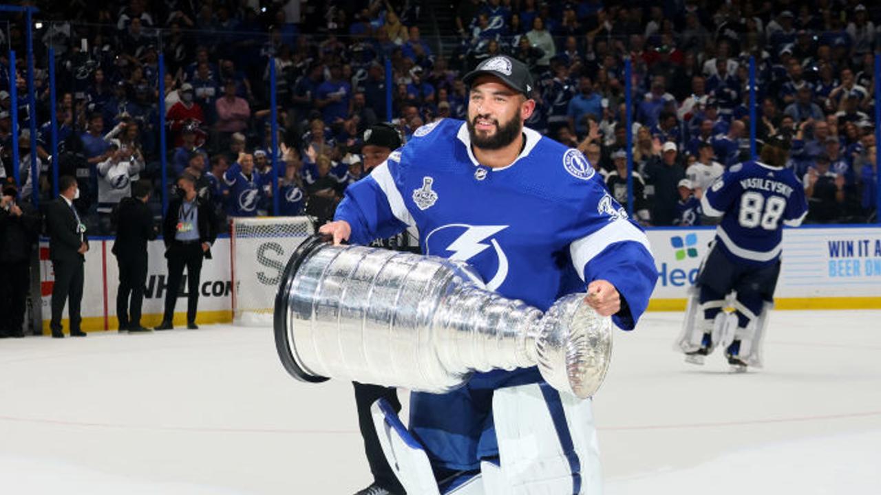 TAMPA, FLORIDA - JULY 07:  Christopher Gibson #33 of the Tampa Bay Lightning celebrates with the Stanley Cup after the 1-0 victory against the Montreal Canadiens in Game Five to win the 2021 NHL Stanley Cup Final at Amalie Arena on July 07, 2021 in Tampa, Florida. (Photo by Bruce Bennett/Getty Images)