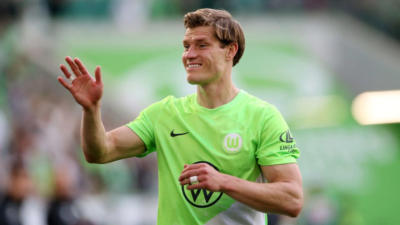 WOLFSBURG, GERMANY - MAY 04: Kevin Behrens of VfL Wolfsburg celebrates victory in the Bundesliga match between VfL Wolfsburg and SV Darmstadt 98 at Volkswagen Arena on May 04, 2024 in Wolfsburg, Germany. (Photo by Cathrin Mueller/Getty Images)