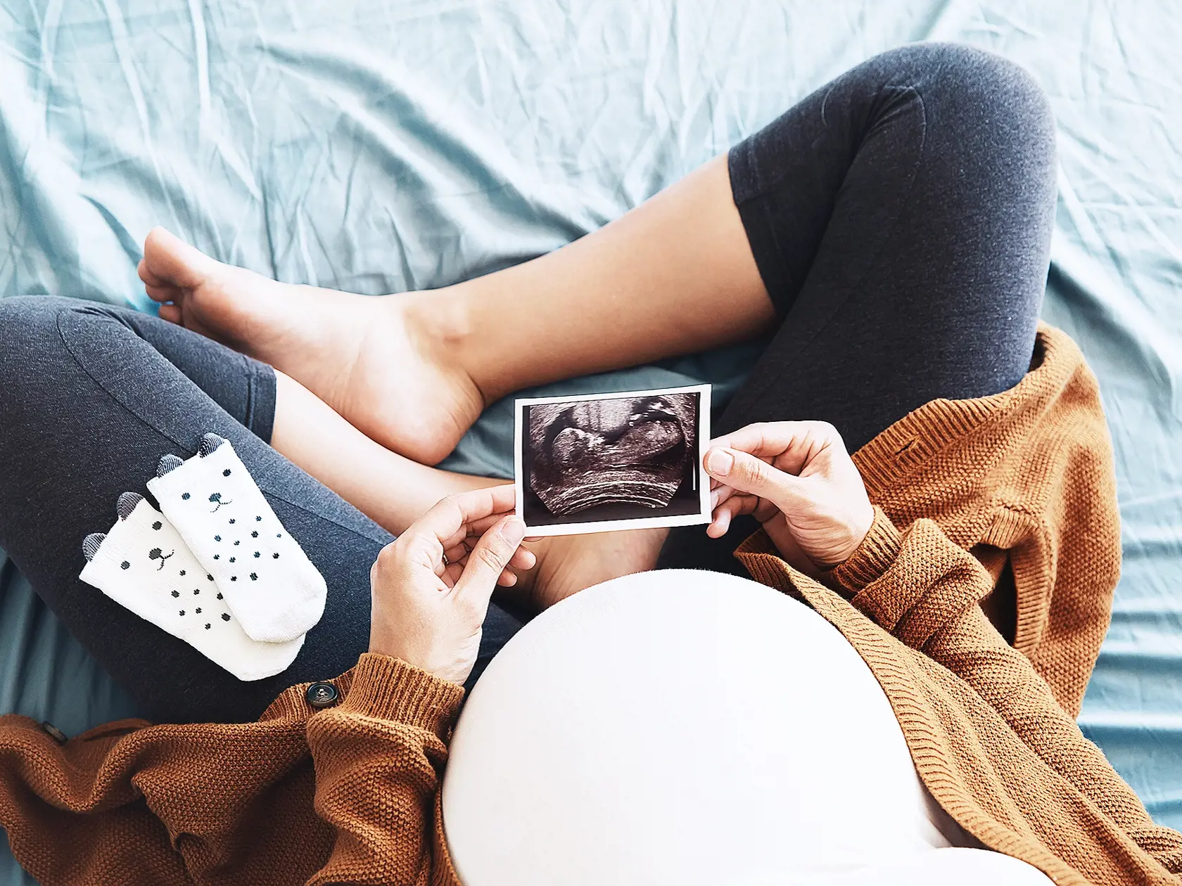 Pregnant,Woman,Holding,Ultrasound,Image.,Concept,Of,Pregnancy,,Health,Care,