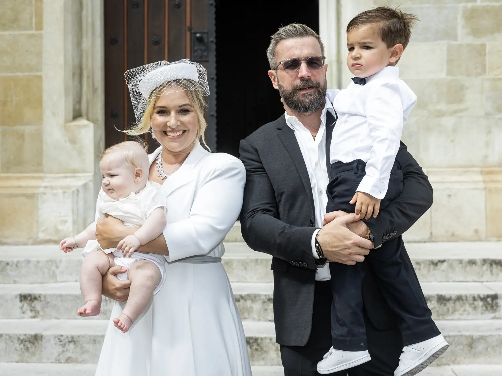 Krst dcéry Dominiky Navara Cibulkovej a Michala Navaru Niny v bratislavskom Dóme svätého Martina. Na snímke Dominika Cibulková s manželom Michalom, synom Jakubom a dcérou Ninou.
