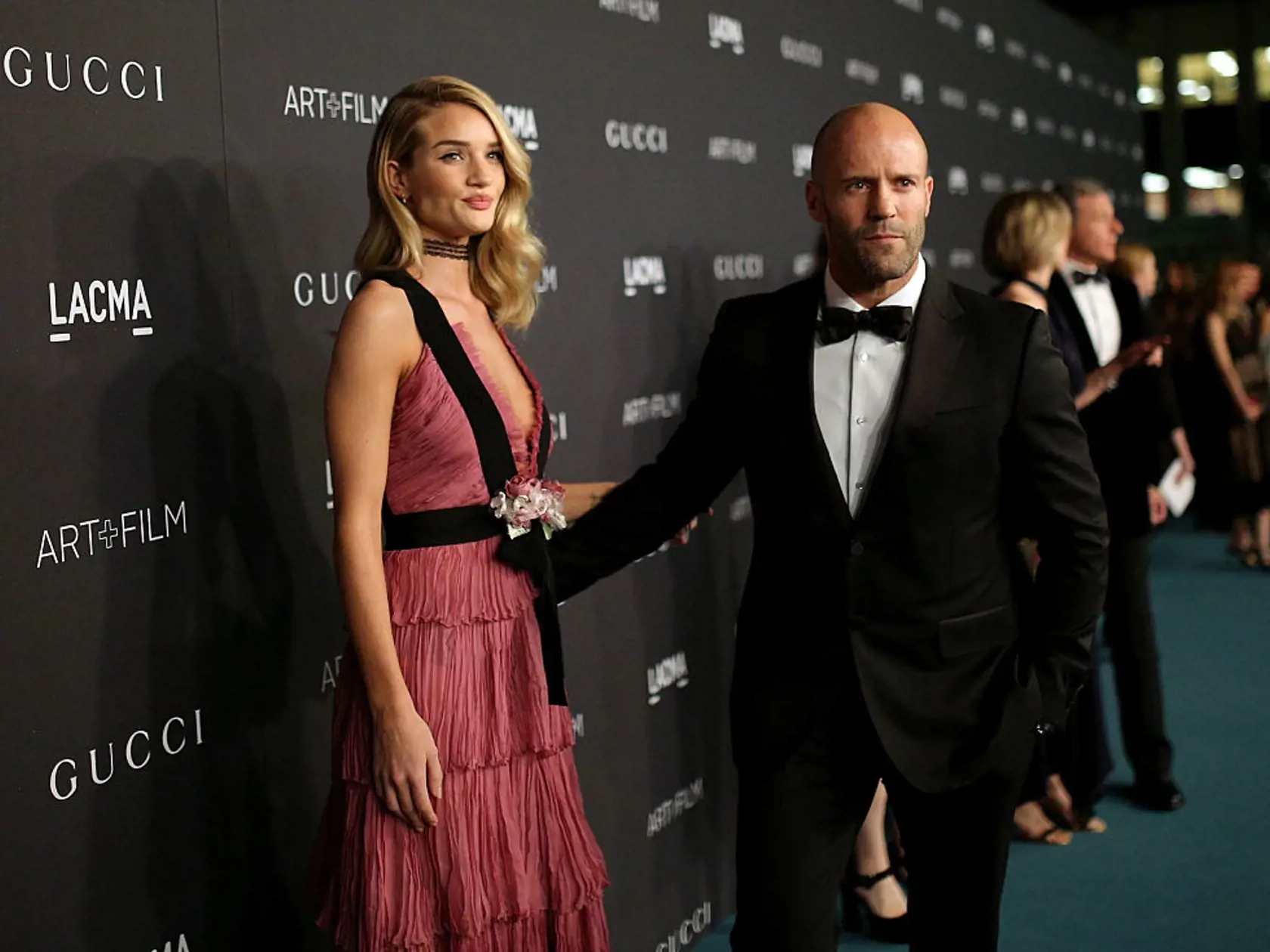 LOS ANGELES, CA - NOVEMBER 07:  Actress Rosie Huntington-Whiteley, wearing Gucci, (L) and actor Jason Statham attend LACMA 2015 Art+Film Gala Honoring James Turrell and Alejandro G Iñárritu, Presented by Gucci at LACMA on November 7, 2015 in Los Angeles, California.  (Photo by Mike Windle/Getty Images for LACMA)