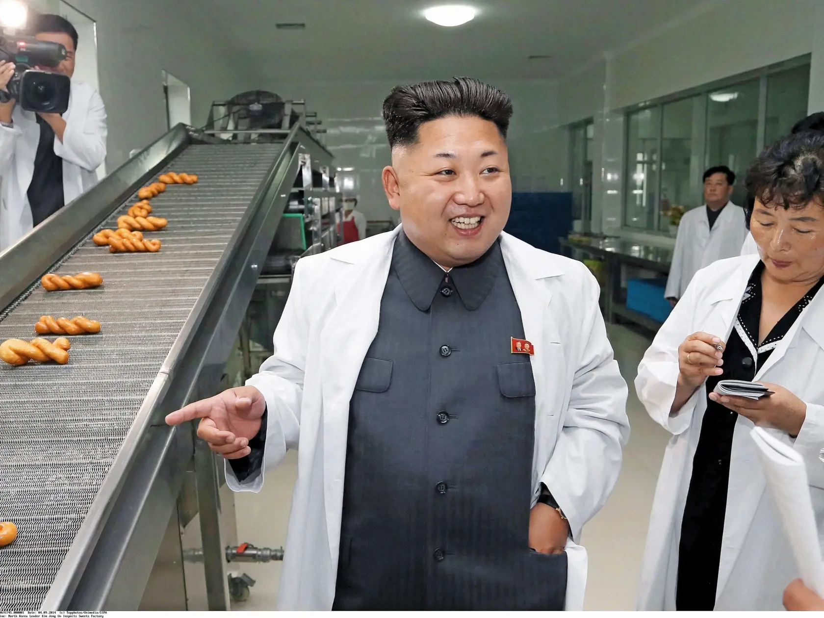 (News-Item): 2014 shows top leader of the Democratic People s Republic of Korea Kim Jong Un inspects the November 2 Factory of the Korean People s Army (KPA). He went around the newly built rooms dedicated to the history of the factory. He said that the rooms were arranged well, adding the factory has a long history. Going round the zeppole, bread and confectionery workshops and other places of the factory, Kim Jon Un learned in detail about the technical updating of production processes and pr