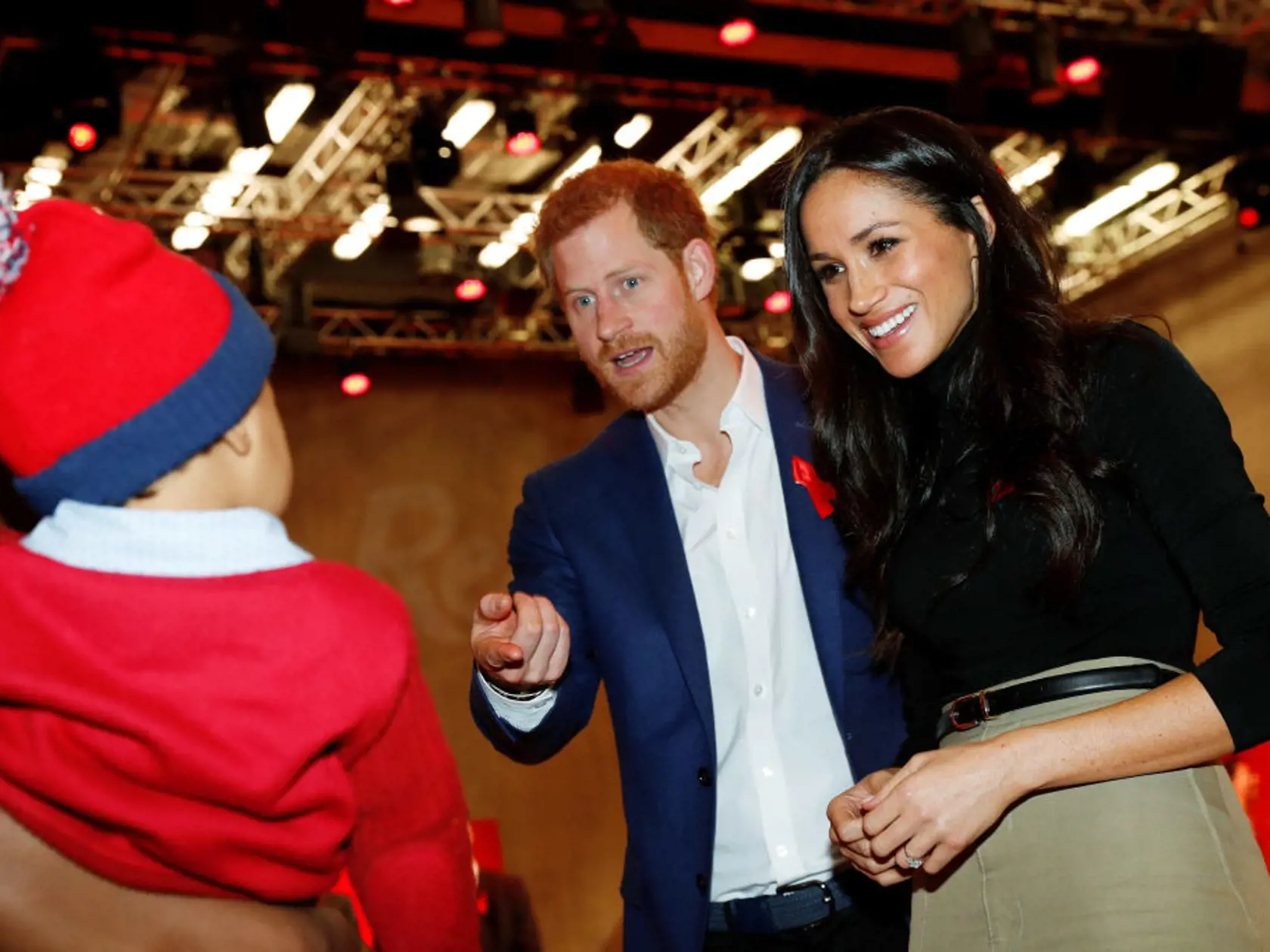 NOTTINGHAM, ENGLAND - DECEMBER 01:   Prince Harry and his fiancee US actress Meghan Markle visit the Terrence Higgins Trust World AIDS Day charity fair at Nottingham Contemporary on December 1, 2017 in Nottingham, England.  Prince Harry and Meghan Markle announced their engagement on Monday 27th November 2017 and will marry at St George's Chapel, Windsor in May 2018.  (Photo by Adrian Dennis - WPA Pool/Getty Images)