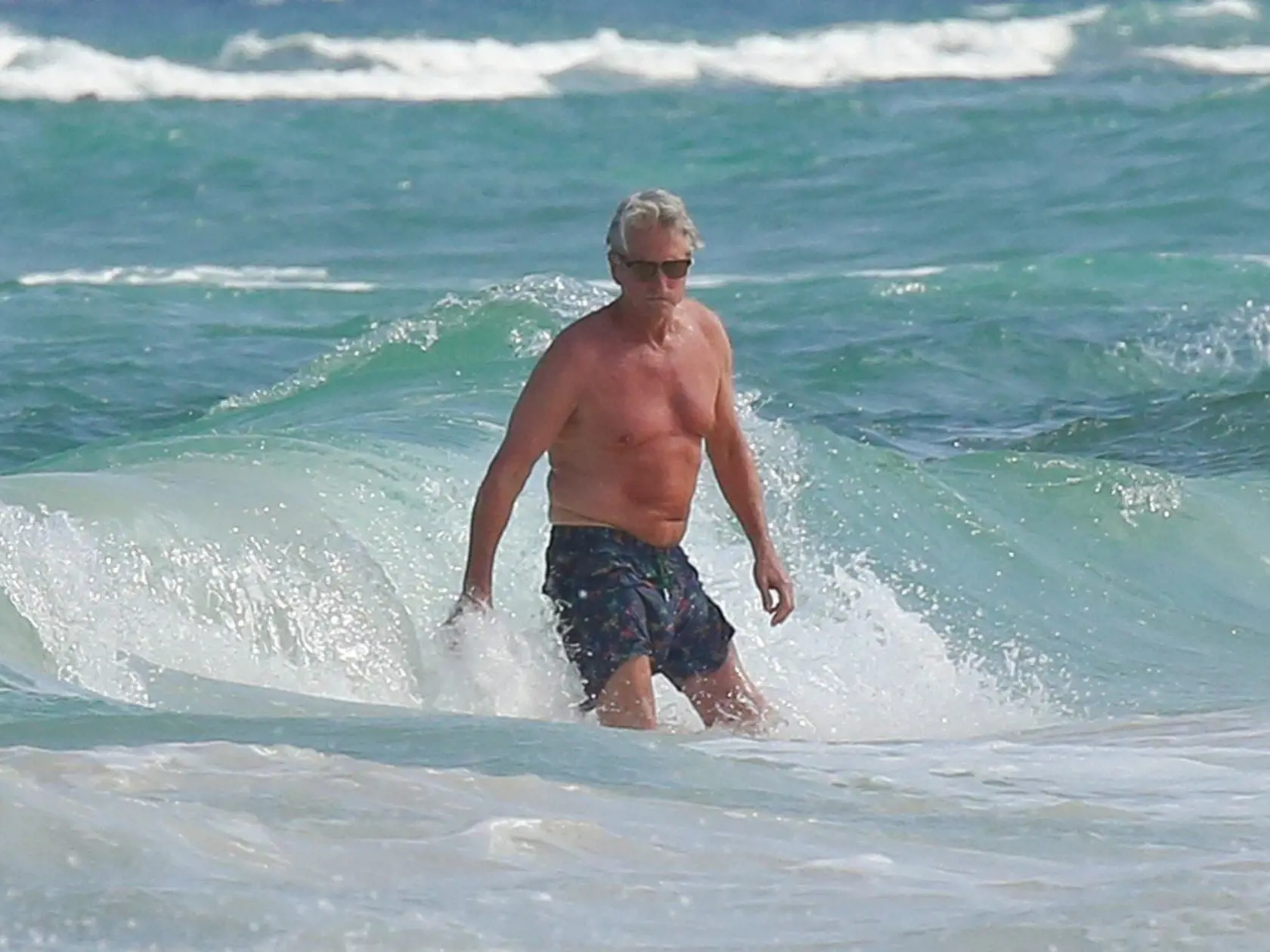 CancÃ, n, Mexico - Michael Douglas looks calm and carefree in Cancun. The 71 year old actor looks like he is doing well as he took the time to walk around the beach and swim in the surf in his navy blue swim shorts.         March 25, 2016, Image: 279413541, License: Rights-managed, Restrictions: , Model Release: no, Credit line: Profimedia, AKM-GSI