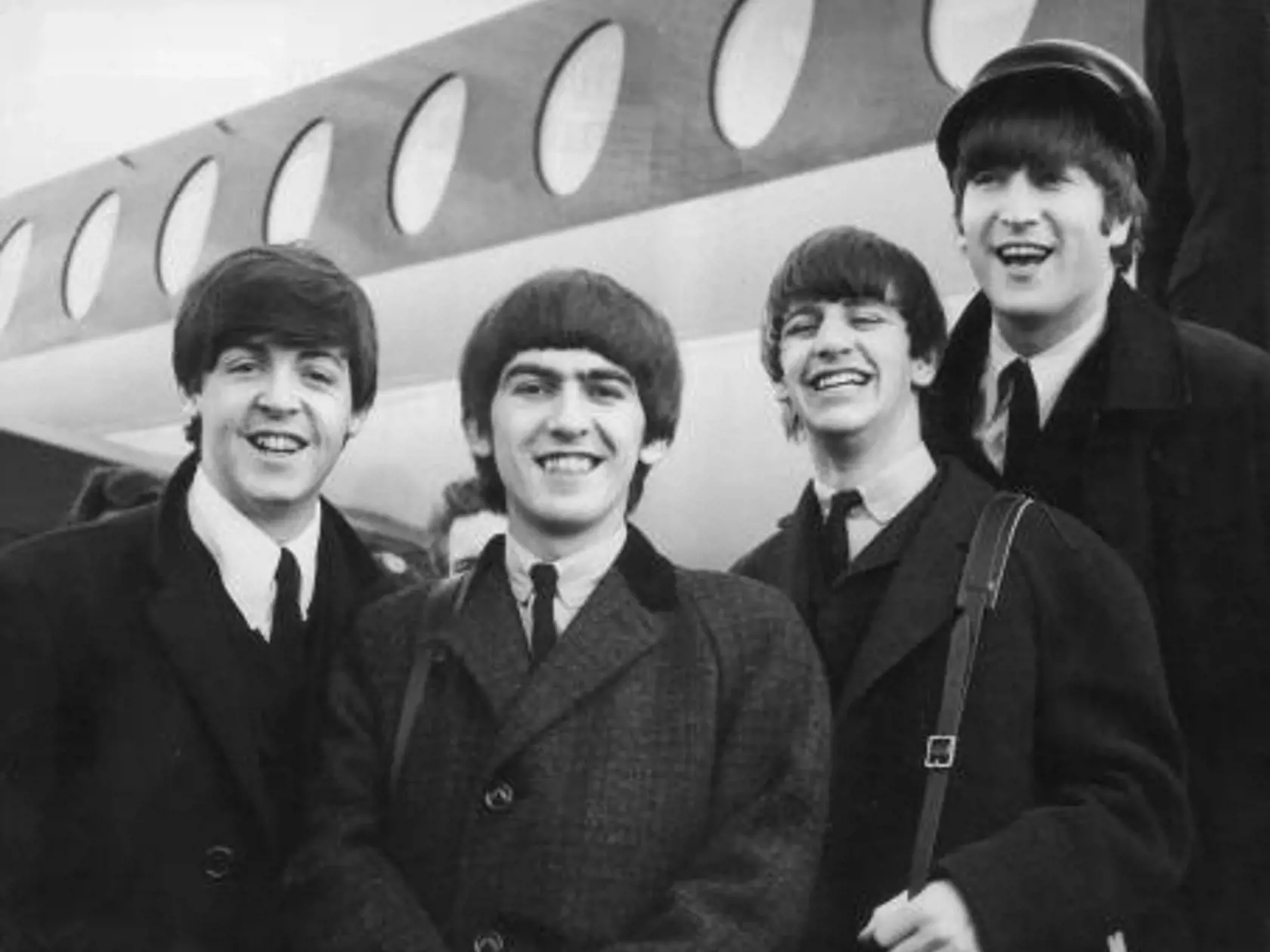 Beatles:  Paul McCartney, George Harrison, Ringo Starr a John Lennon