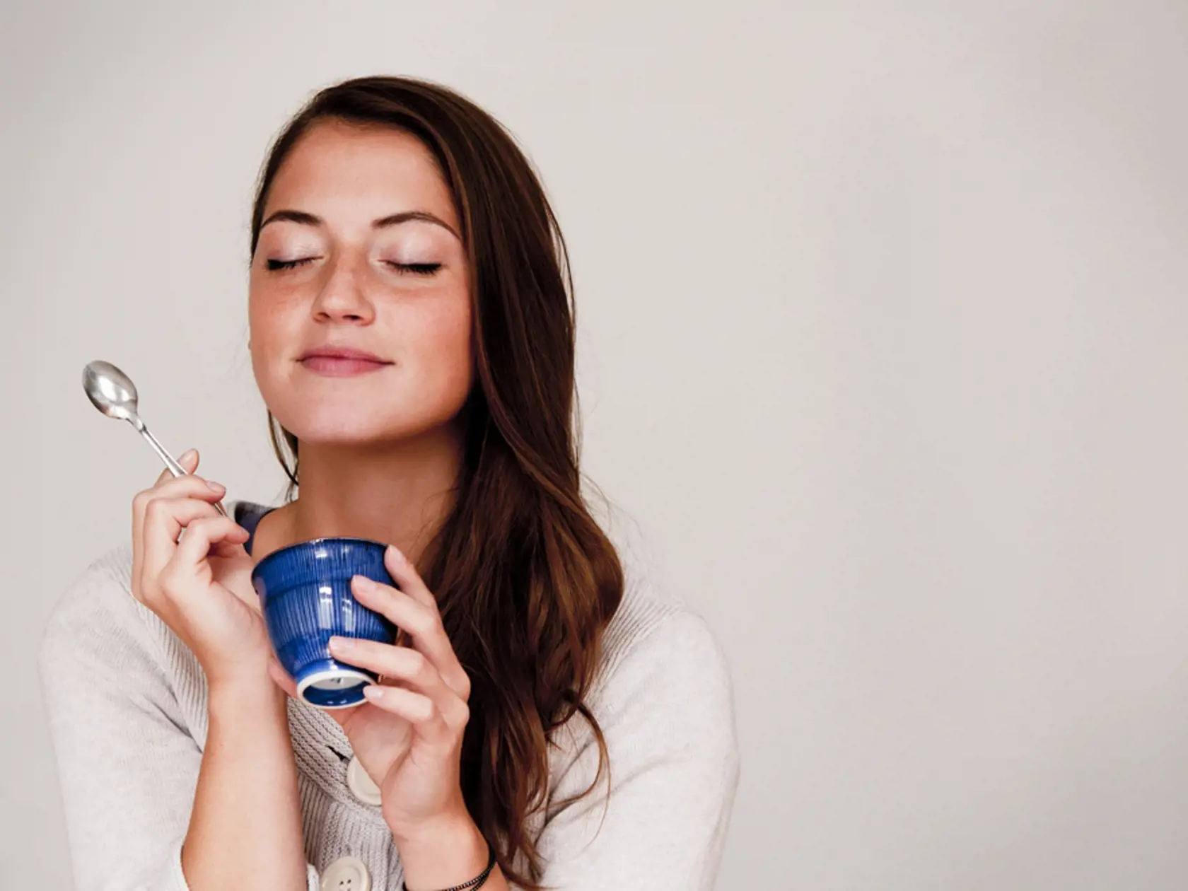 Woman,Eating,Out,Of,Small,Dish
