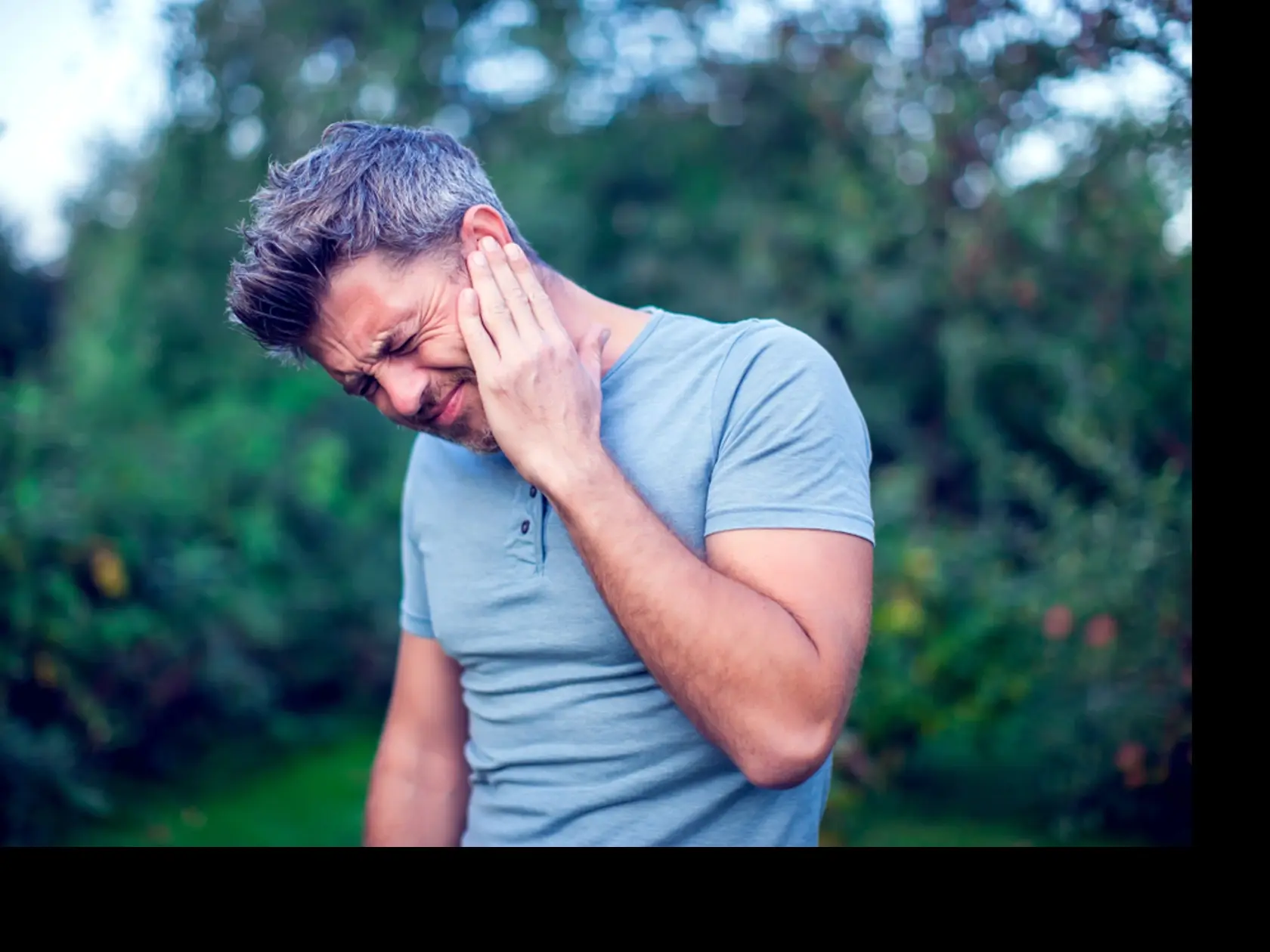 Unhappy,Man,Having,Ear,Pain,Touching,His,Painful,Head,Outdoor