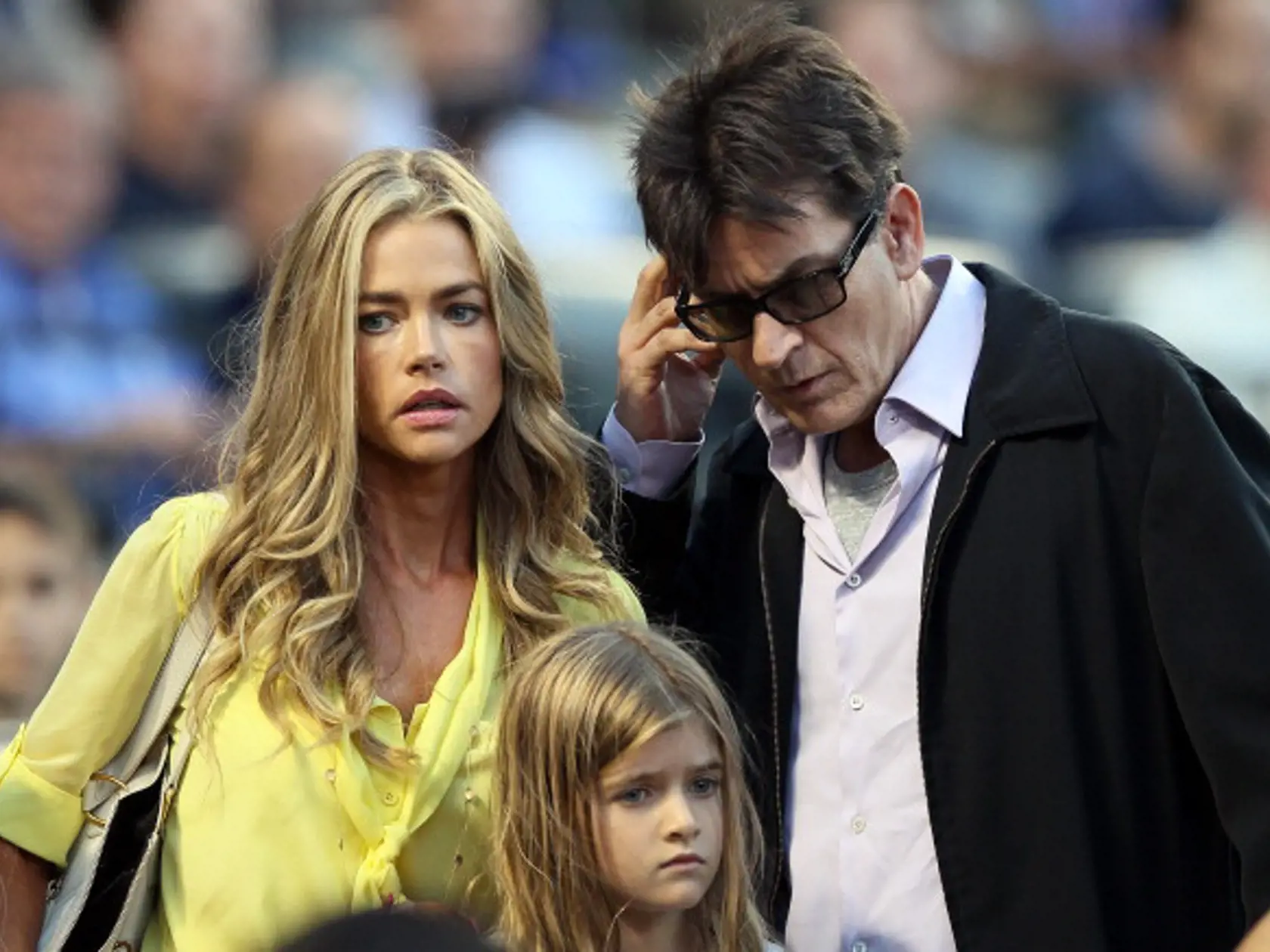 NEW YORK, NY - JUNE 23:  Denise Richards and Charlie Sheen look for their seats as the New York Yankees take on the New York Mets on June 23, 2012 during interleague play at Citi Field in the Flushing neighborhood of the Queens borough of New York City.  (Photo by Elsa/Getty Images)
