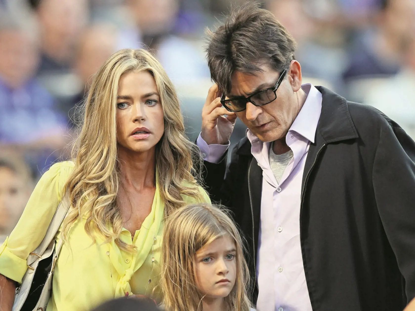 NEW YORK, NY - JUNE 23:  Denise Richards and Charlie Sheen look for their seats as the New York Yankees take on the New York Mets on June 23, 2012 during interleague play at Citi Field in the Flushing neighborhood of the Queens borough of New York City.  (Photo by Elsa/Getty Images)