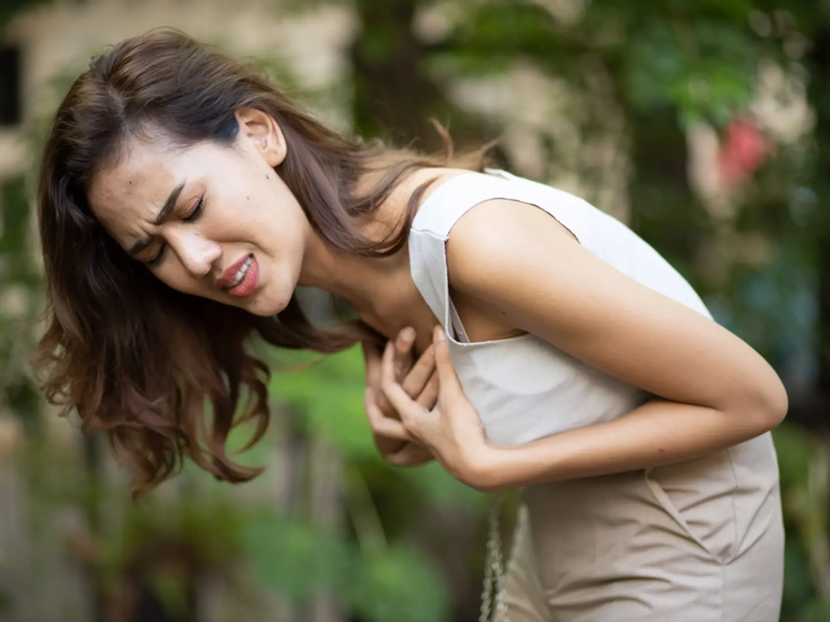 Woman,Suffering,From,Sudden,Heart,Attack,,Concept,Of,Heart,Disease