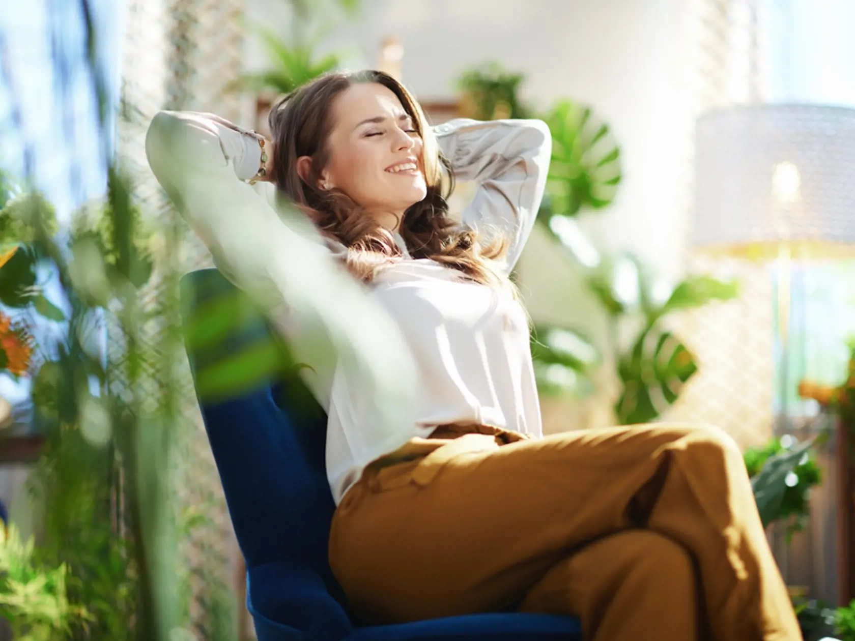 Green,Home.,Relaxed,Stylish,Woman,With,Long,Wavy,Hair,At