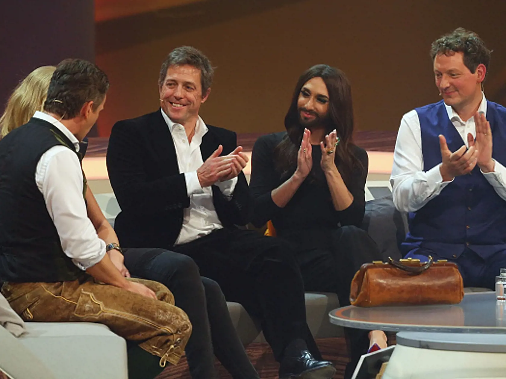 GRAZ, AUSTRIA - NOVEMBER 08: Hugh Grant, Conchita Wurst and Eckart von Hirschhausen attend Wetten, dass..? from Graz on November 08, 2014 in Graz, Austria. (Photo Mathias Kniepeiss/Getty Images)