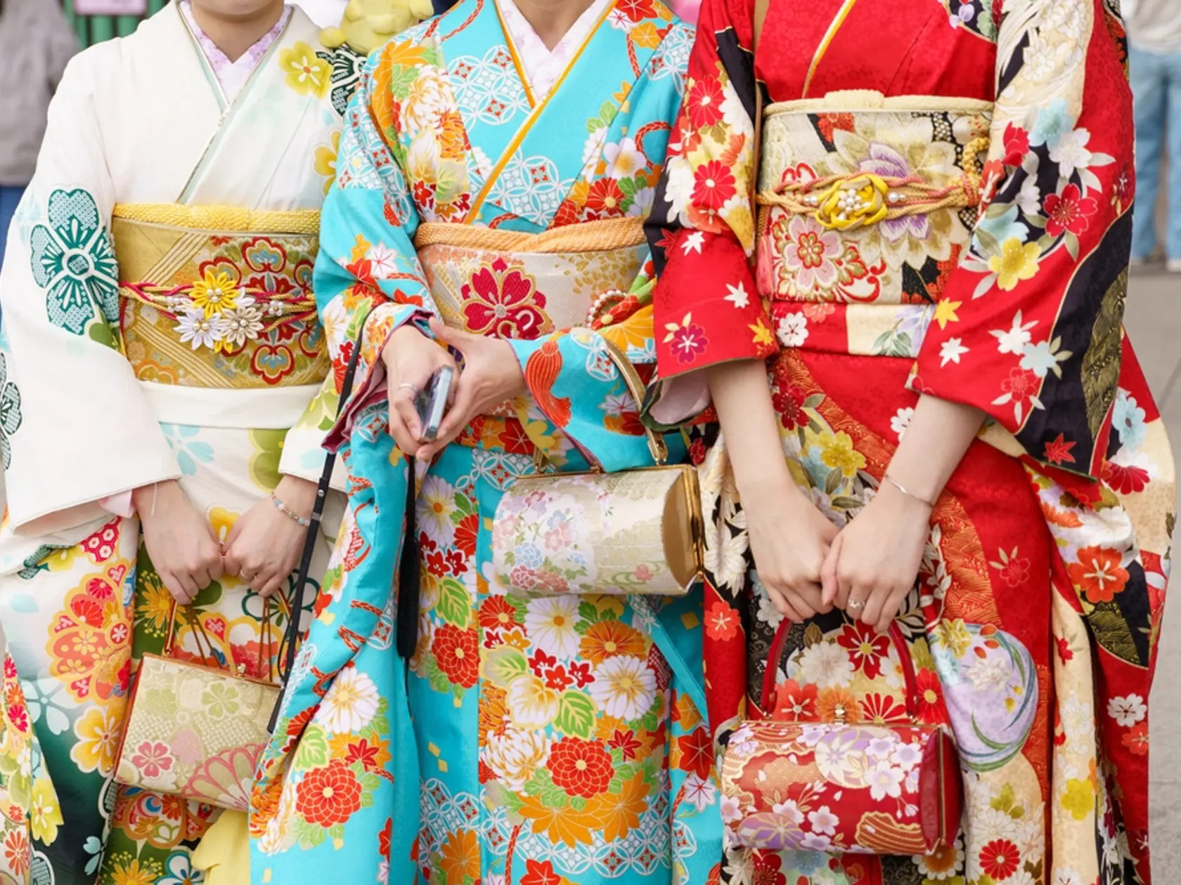 Young girl wearing Japanese kimono standing in front of Sensoji Temple in Tokyo, Japan. Kimono is a Japanese traditional garment. The word "kimono", which actually means a "thing to wear"