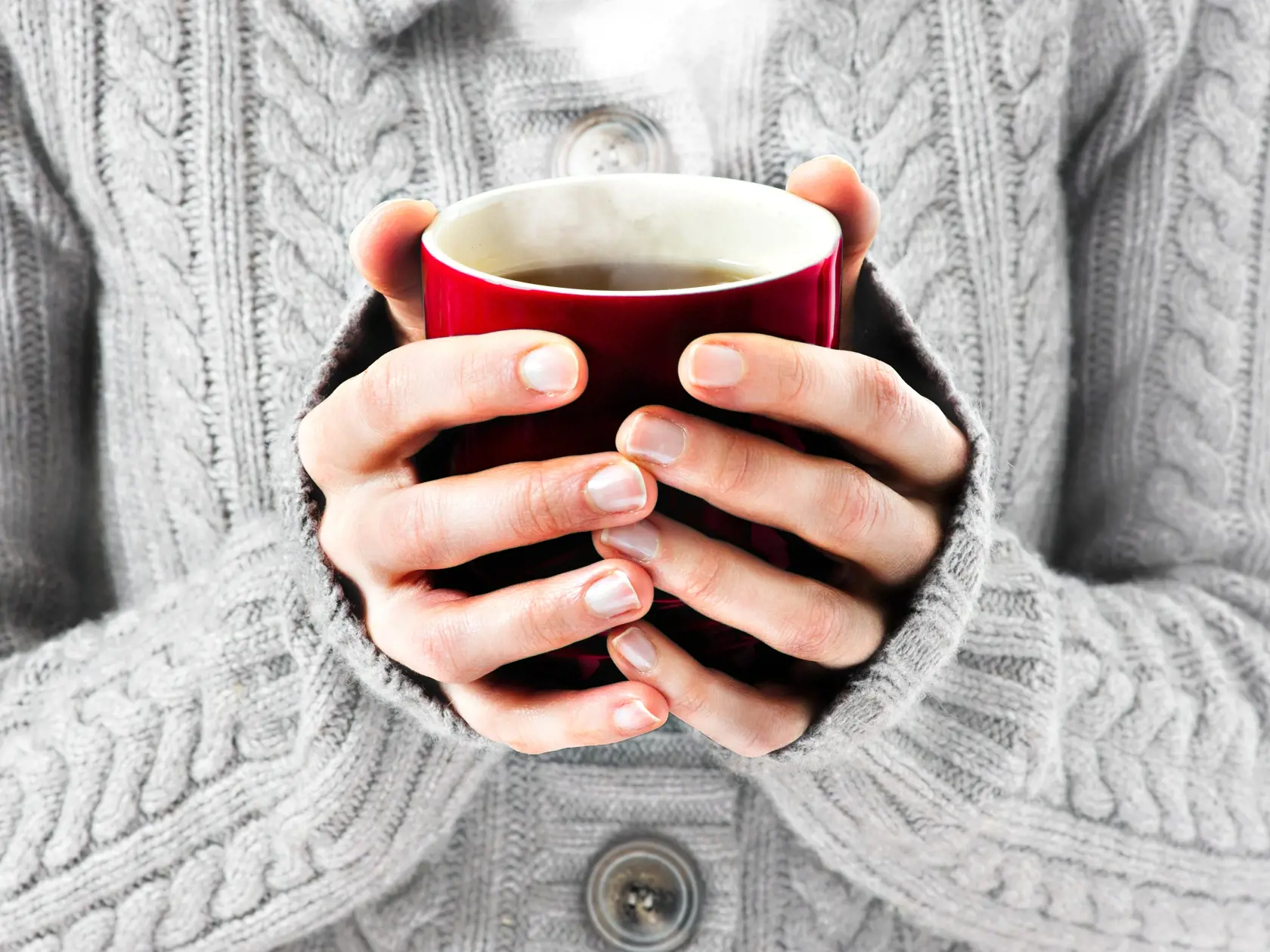 Hot,Red,Cup,In,Woman's,Hands