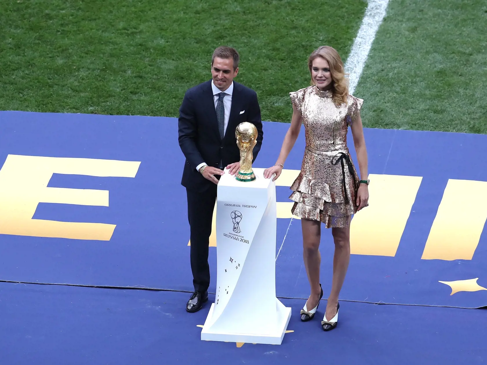 MOSCOW, RUSSIA - JULY 15: Former German International Footballer, Philipp Lahm and Philanthropist, Natalia Vodianova present the 2018 FIFA World Cup Original Trophy ahead of the 2018 FIFA World Cup Final between France and Croatia at Luzhniki Stadium on July 15, 2018 in Moscow, Russia.  (Photo by Catherine Ivill/Getty Images)