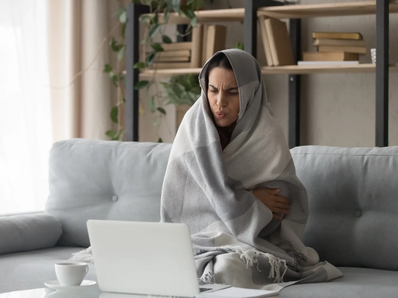 Sick,Ill,Young,Woman,Feel,Cold,Covered,With,Blanket,Sit