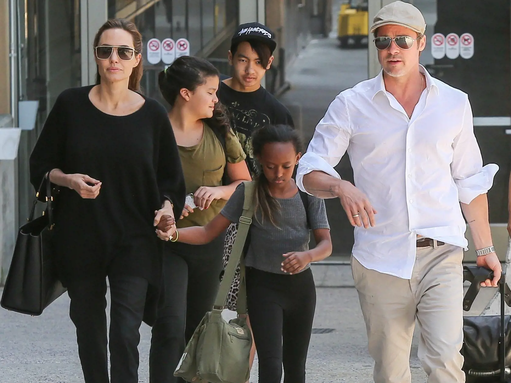 June 14, 2014: Angelina Jolie, Brad Pitt and their kids Zahara and Maddox arriving on a flight from London at LAX airport in Los Angeles, California., Image: 196383567, License: Rights-managed, Restrictions: , Model Release: no, Credit line: Profimedia, INF
