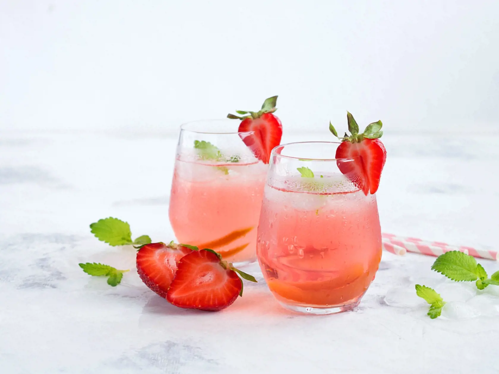Iced,Tea,With,Strawberries,And,Mint.,On,A,White,Background.