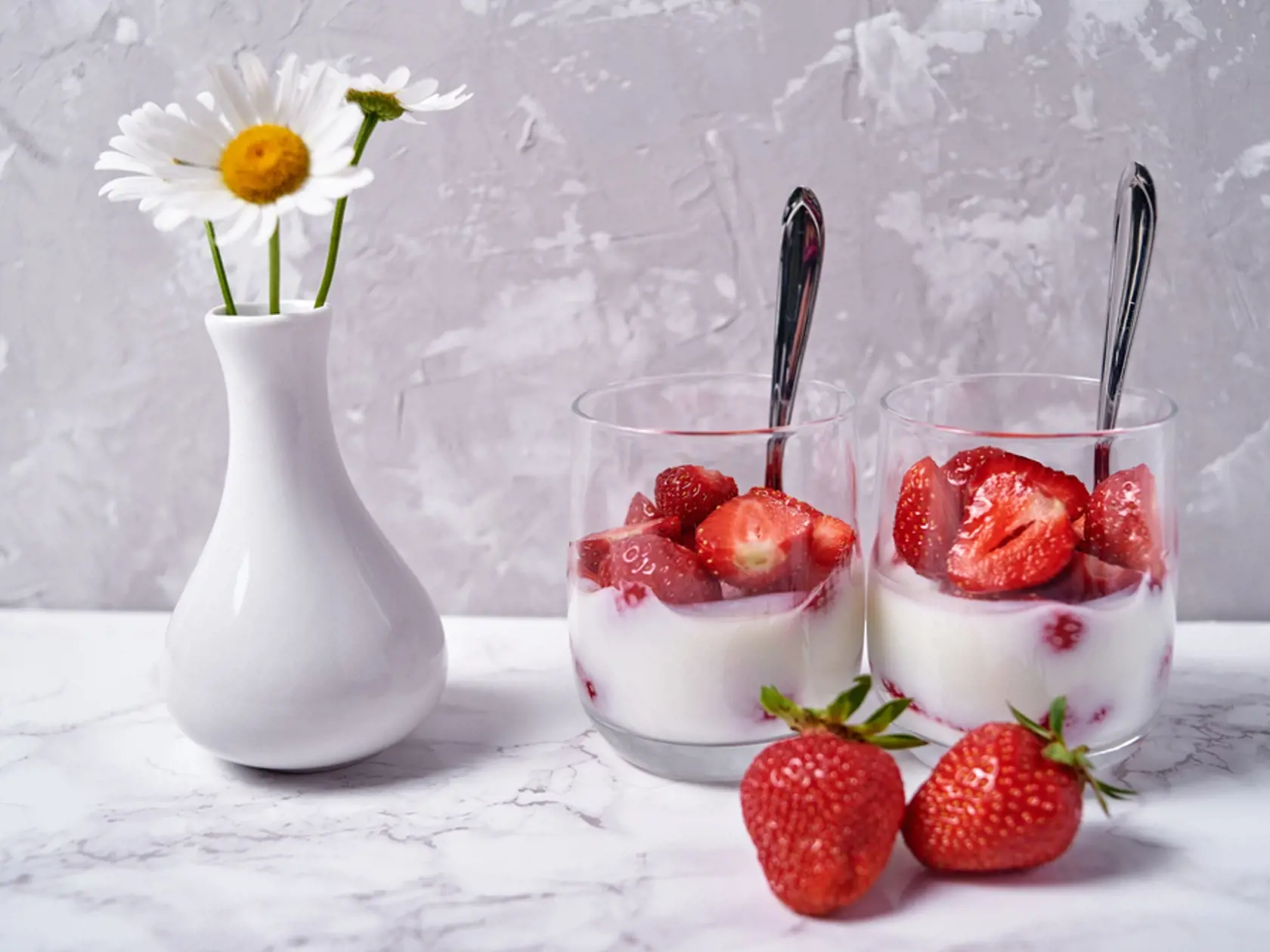Two,Glasses,Of,Healthy,Yogurt,With,Fresh,Sliced,Strawberry,,Spoons