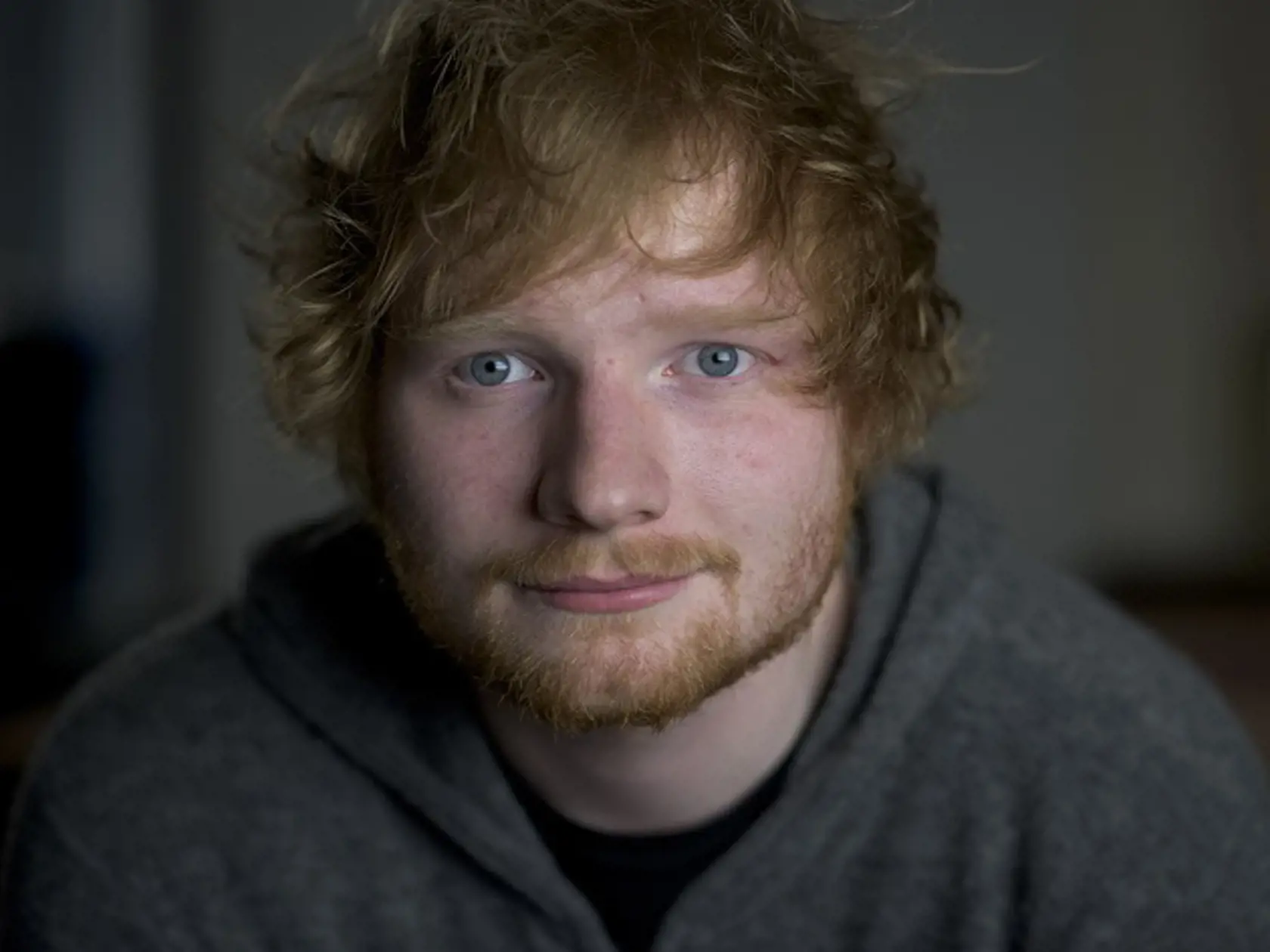 In this Friday, Oct. 16, 2015 photo, Ed Sheeran poses for a portrait in promotion of his full-length concert feature, "Ed Sheeran: Jumpers for Goalposts," in New York. The movie premieres in London this week. (Photo by Drew Gurian/Invision/AP)