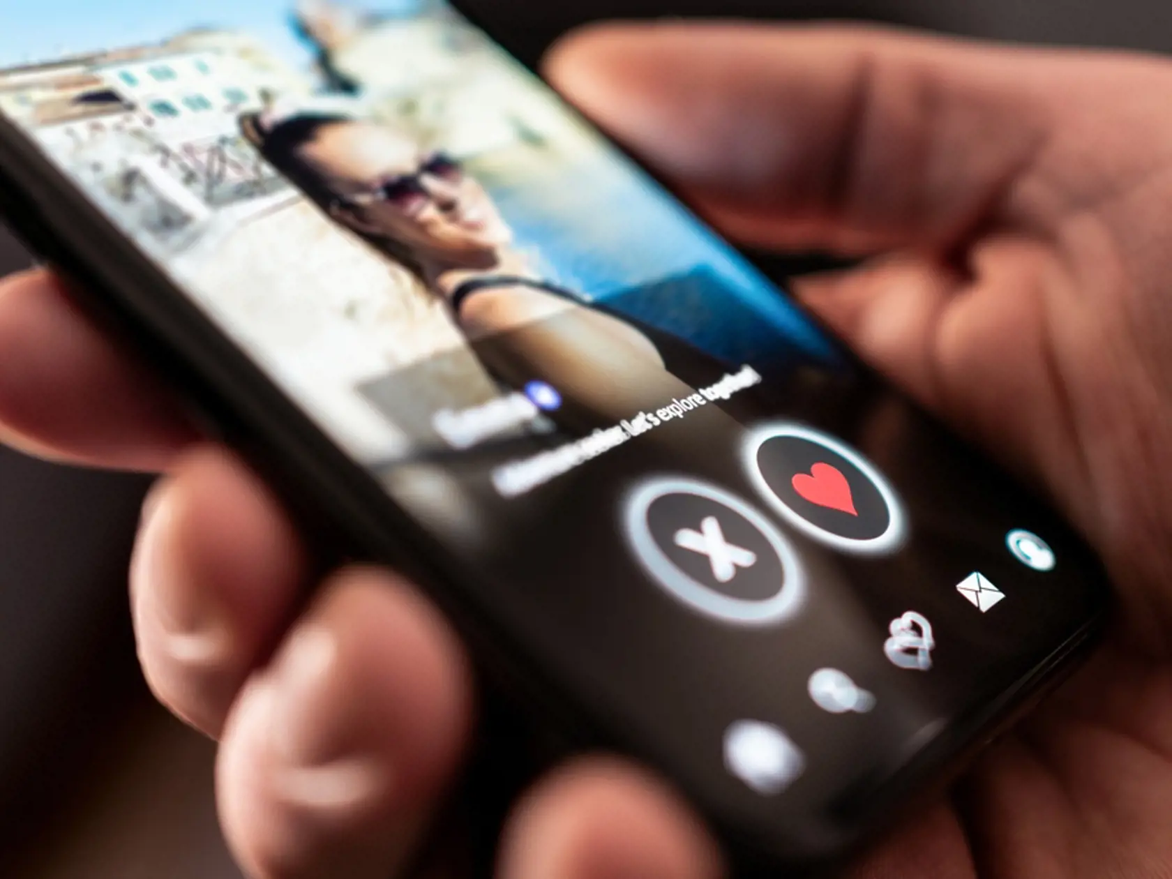 Date app, online site. Swipe for love and relationship. Right or left. Profile photo of a woman. Man with phone. Match on mobile application or website on internet. Cheating or stalker concept.