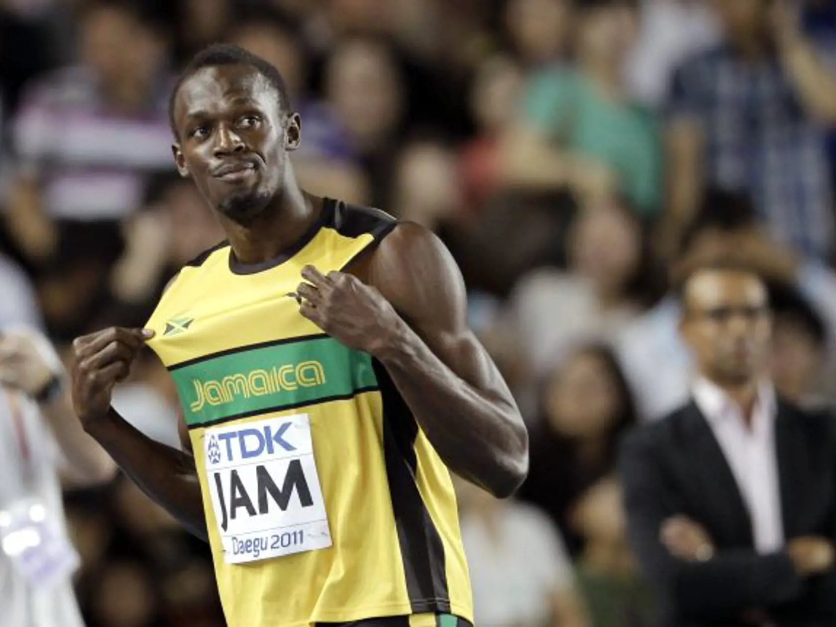 Jamaica's Usain Bolt celebrates after winning the gold medal and setting a new world record in the Men's 4x100m relay final at the World Athletics Championships in Daegu, South Korea, Sunday, Sept. 4, 2011. (AP Photo/Matt Dunham)