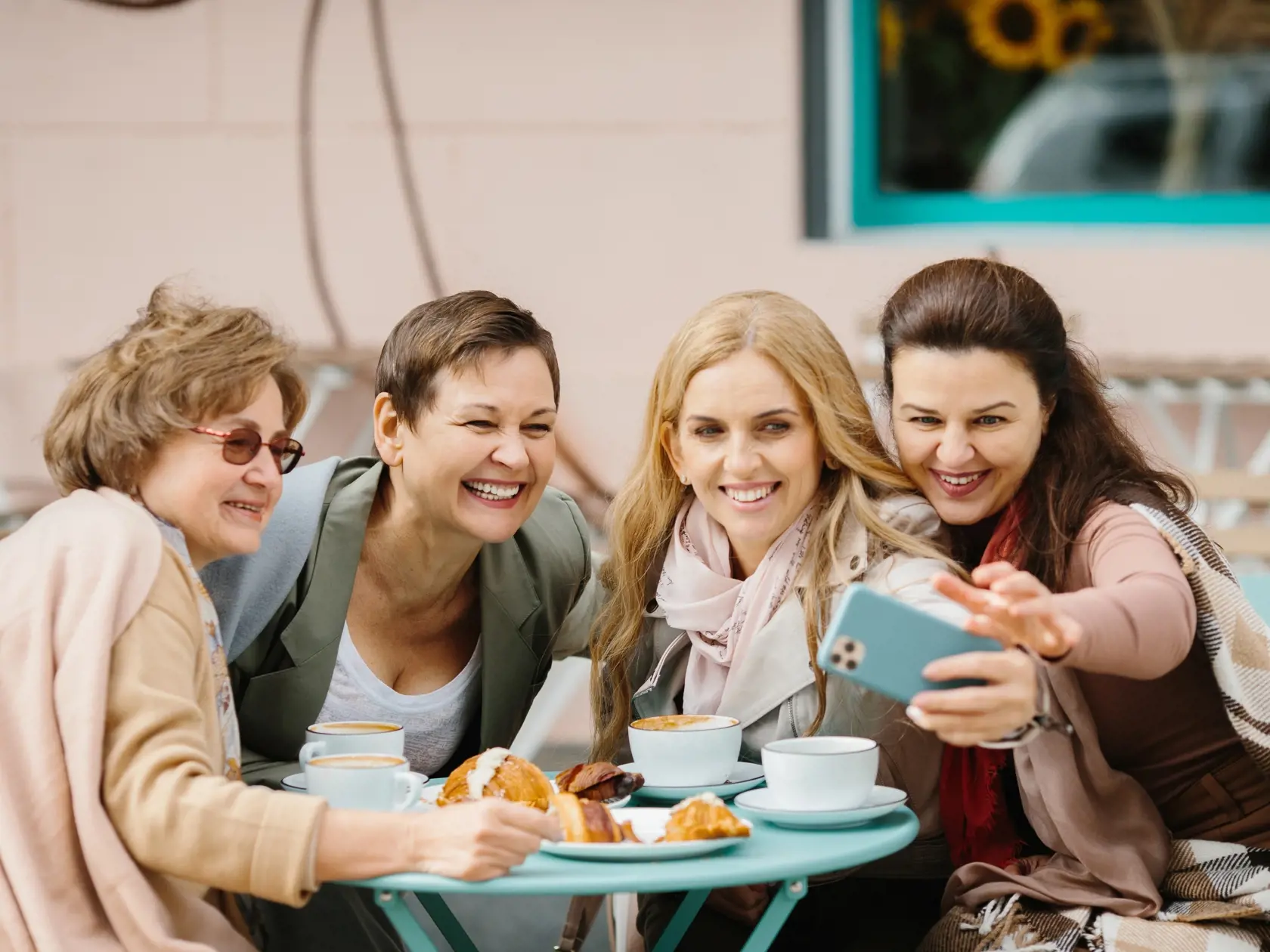 Three,Caucasian,Pretty,Senior,Women,Friends,Sitting,With,Coffee,At