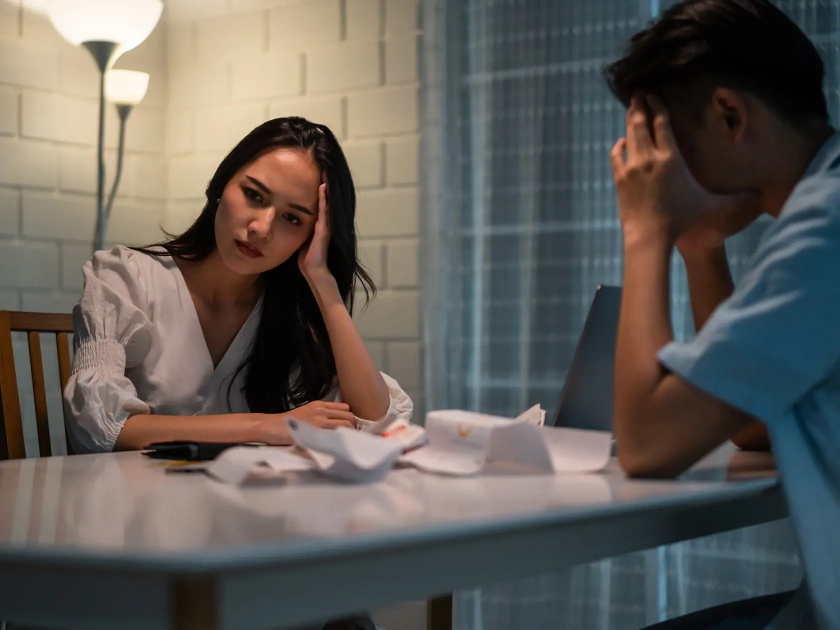 Asian,Young,Depressed,Couple,Having,Argument,While,Checking,Money,Debt.