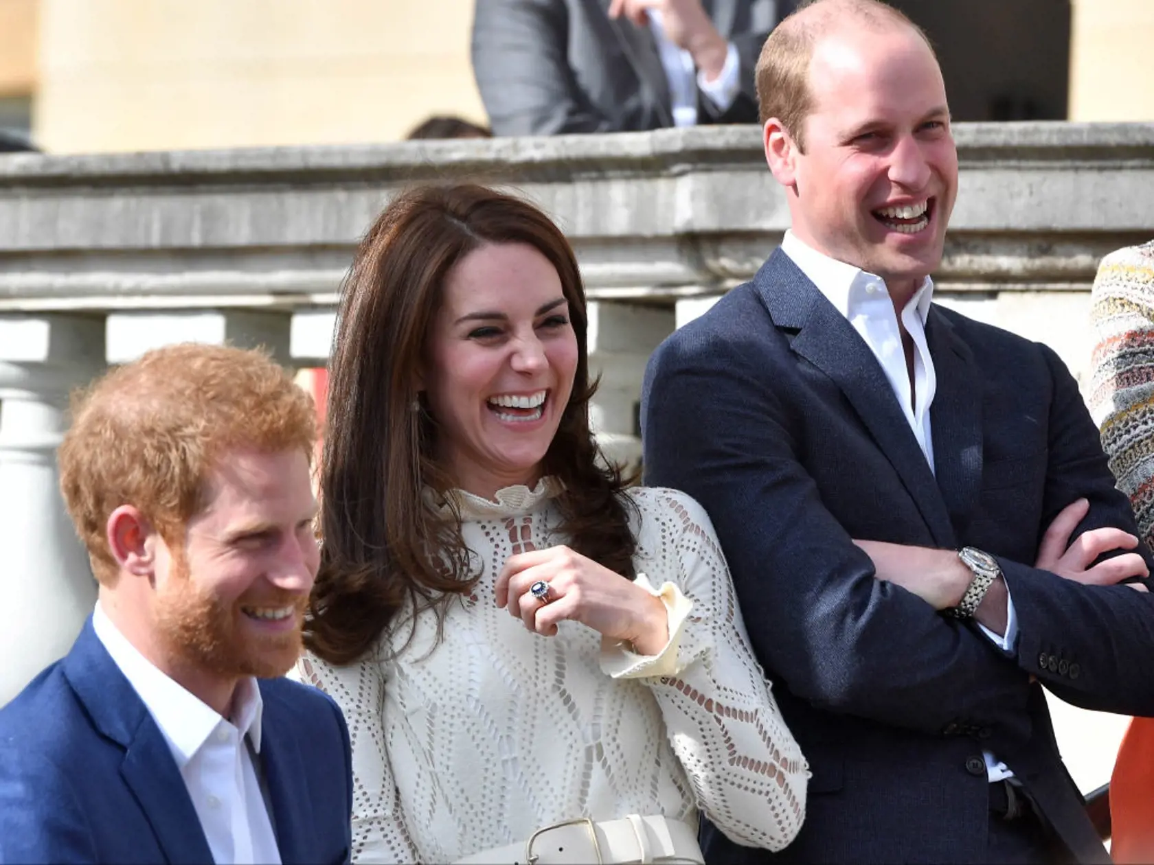 LONDON, UNITED KINGDOM - MAY 13: Prince Harry, Catherine, Duchess of Cambridge and Prince William, Duke of Cambridge laugh as they host a tea party in the grounds of Buckingham Palace to honour the children of those who have died serving in the armed forces on May 13, 2017 in London, England. (Photo by Andrew Parsons - WPA Pool/Getty Images)