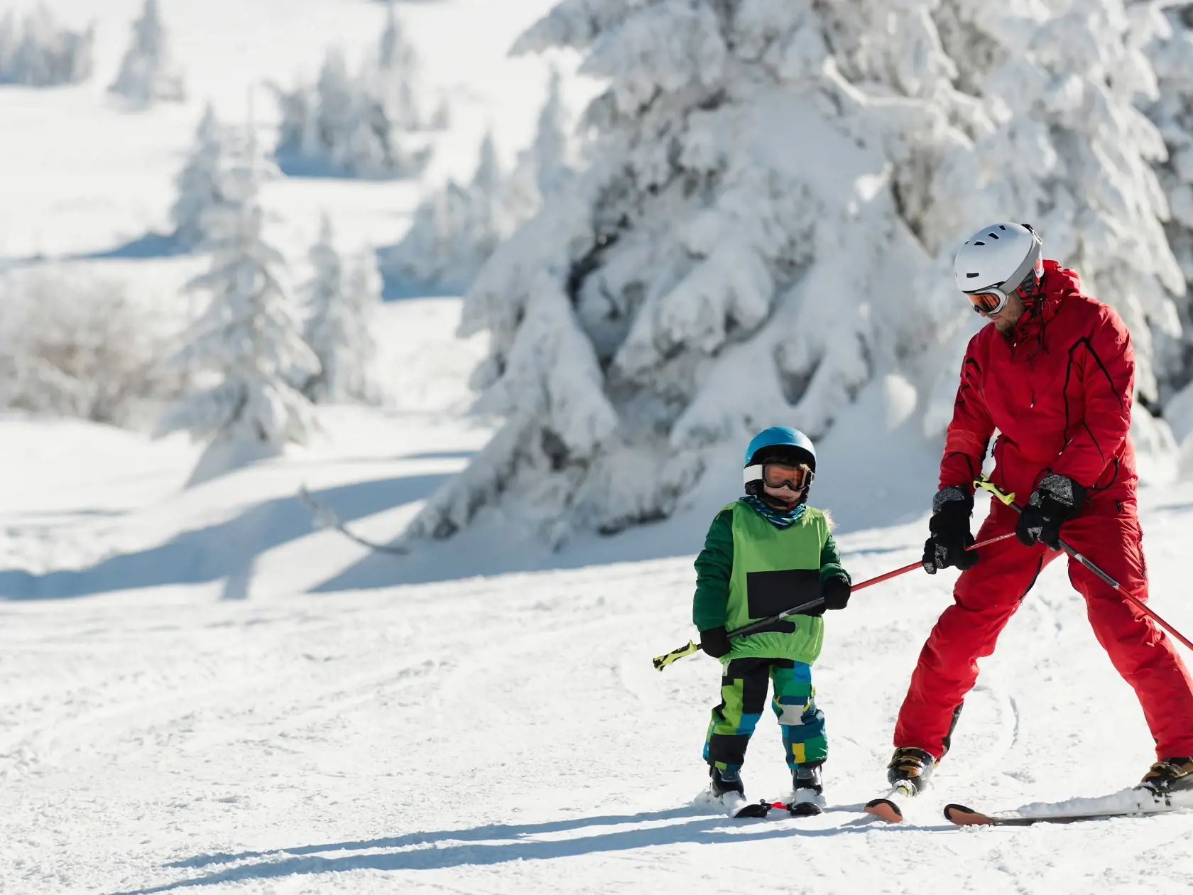 Little,Boy,Learning,To,Ski,With,Instructor