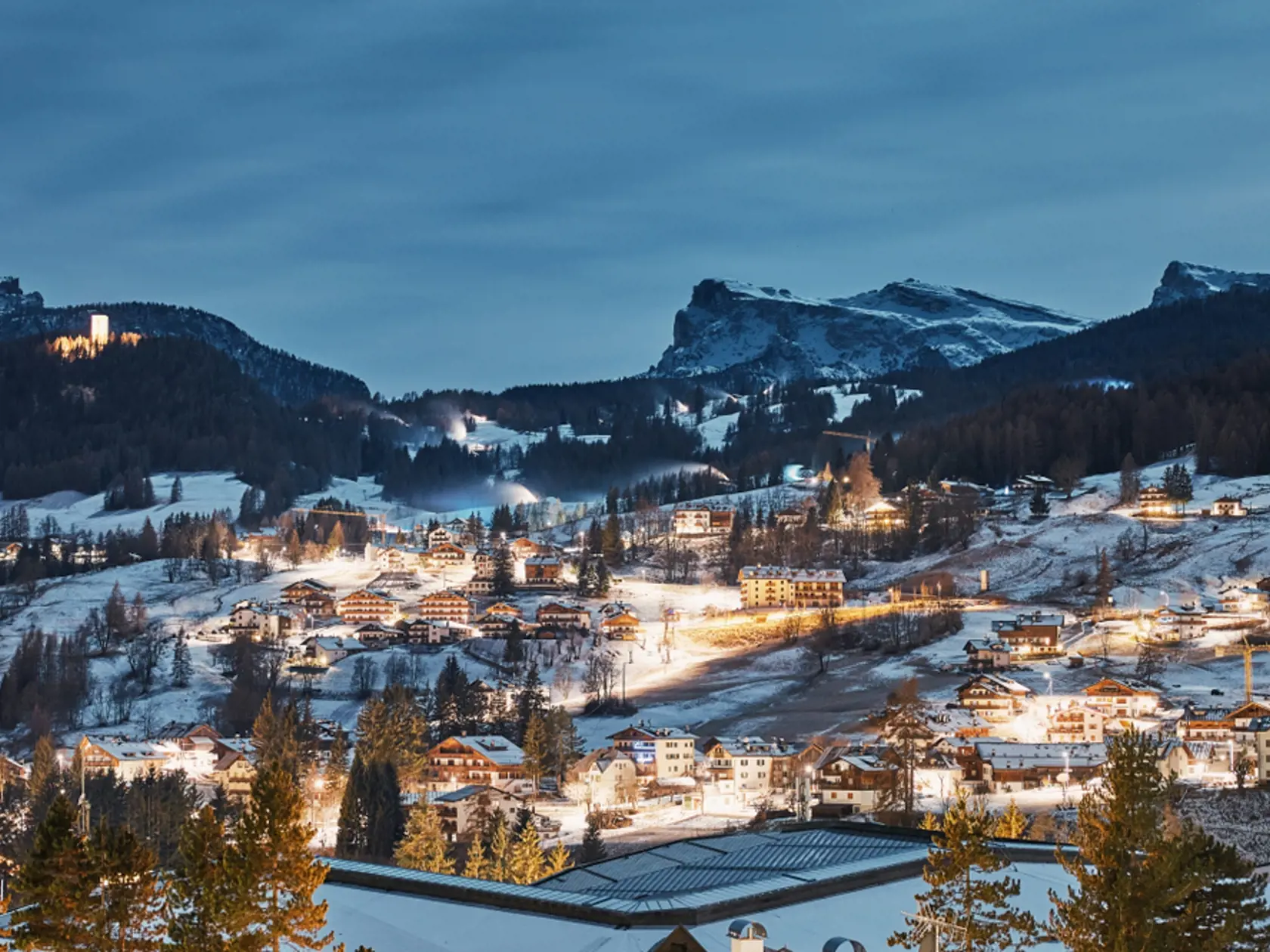 Cortina,Dâ€™ampezzo,Ski,Resort,City,At,Night.,Mountains,Covered,In