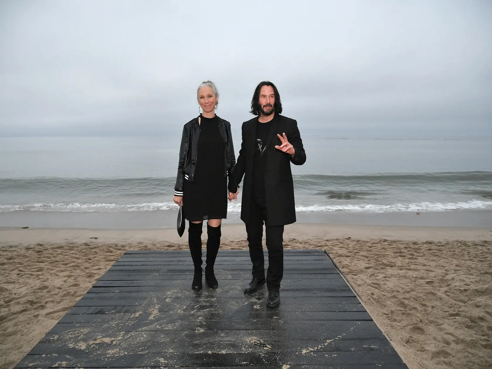 MALIBU, CALIFORNIA - JUNE 06: (L-R)  Alexandra Grant and Keanu Reeves attend the Saint Laurent Mens Spring Summer 20 Show Photo Call on June 06, 2019 in Malibu, California. (Photo by Neilson Barnard/Getty Images)