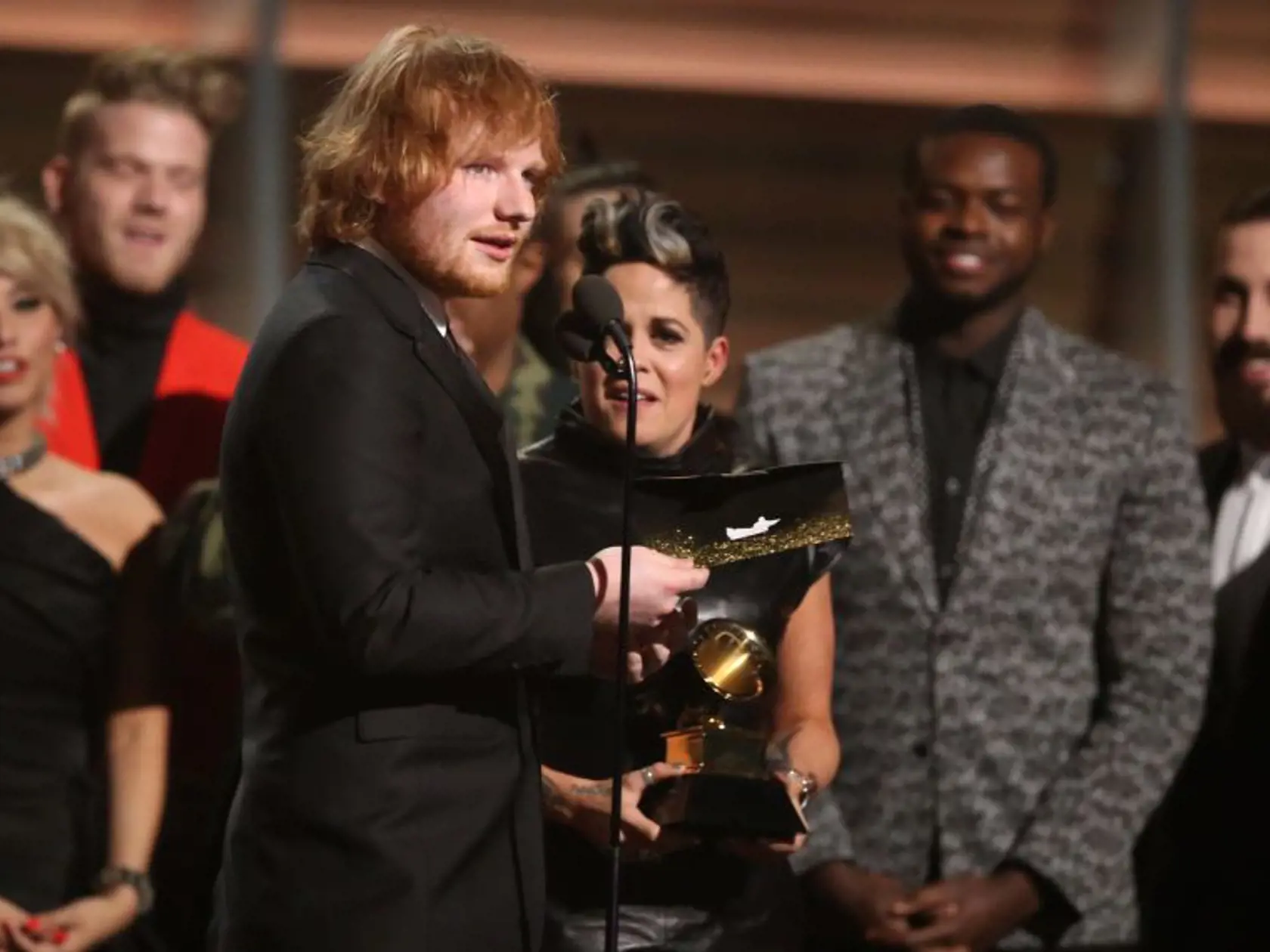 Ed Sheeran accepts the award for song of the year for “Thinking Out Loud” at the 58th annual Grammy Awards on Monday, Feb. 15, 2016, in Los Angeles. (Photo by Matt Sayles/Invision/AP)