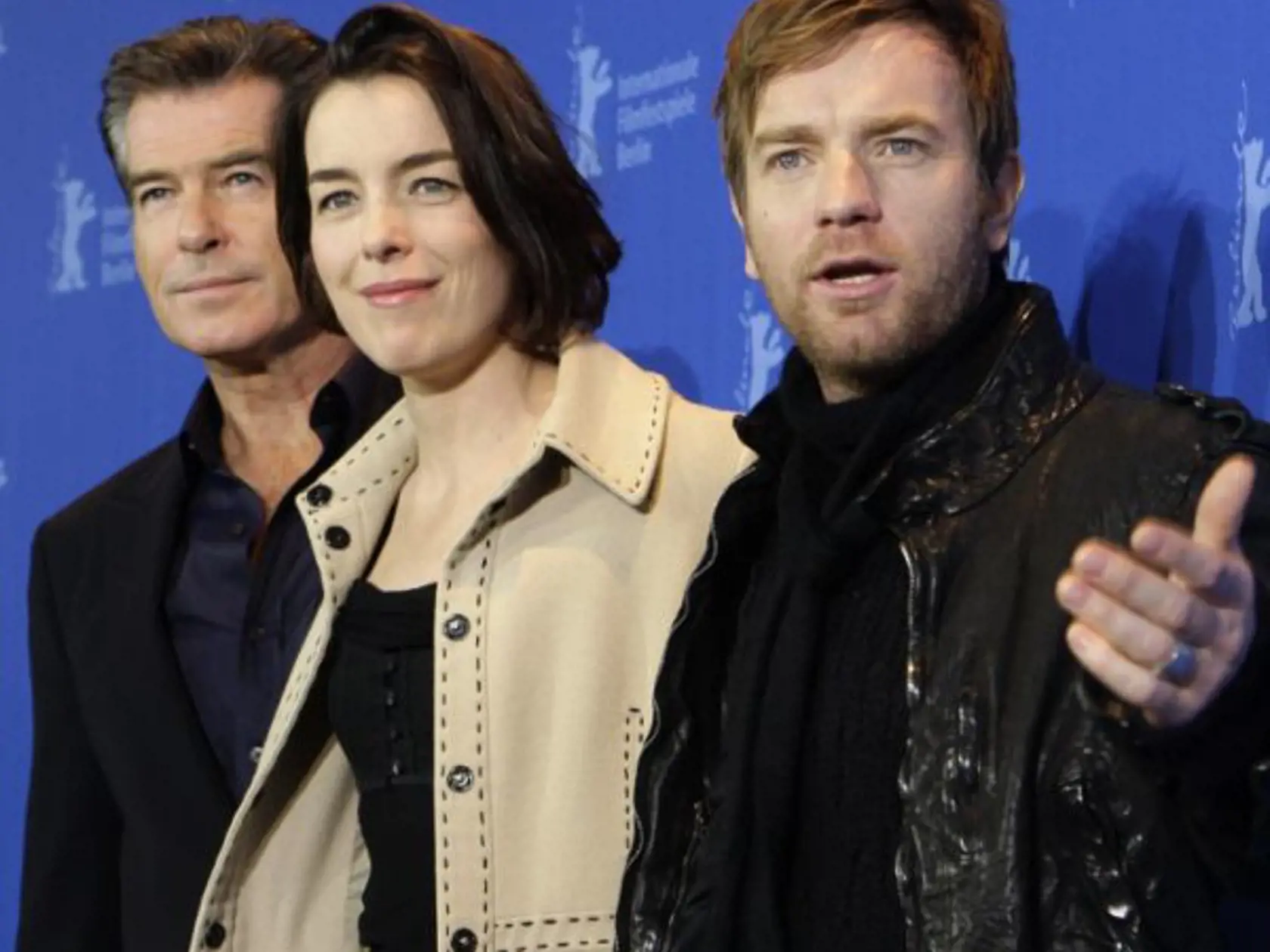 Irish actor Pierce Brosnan and British actors Olivia Williams and Ewan Mcgregor pose at the photo call for the film 'The Ghost Writer' at the International Film Festival Berlinale in Berlin, Germany, Friday, Feb. 12, 2010. The film's director, Roman Polanski, is absent from the festival as he remains under house arrest at his chalet in Switzerland. (AP Photo/Joel Ryan )