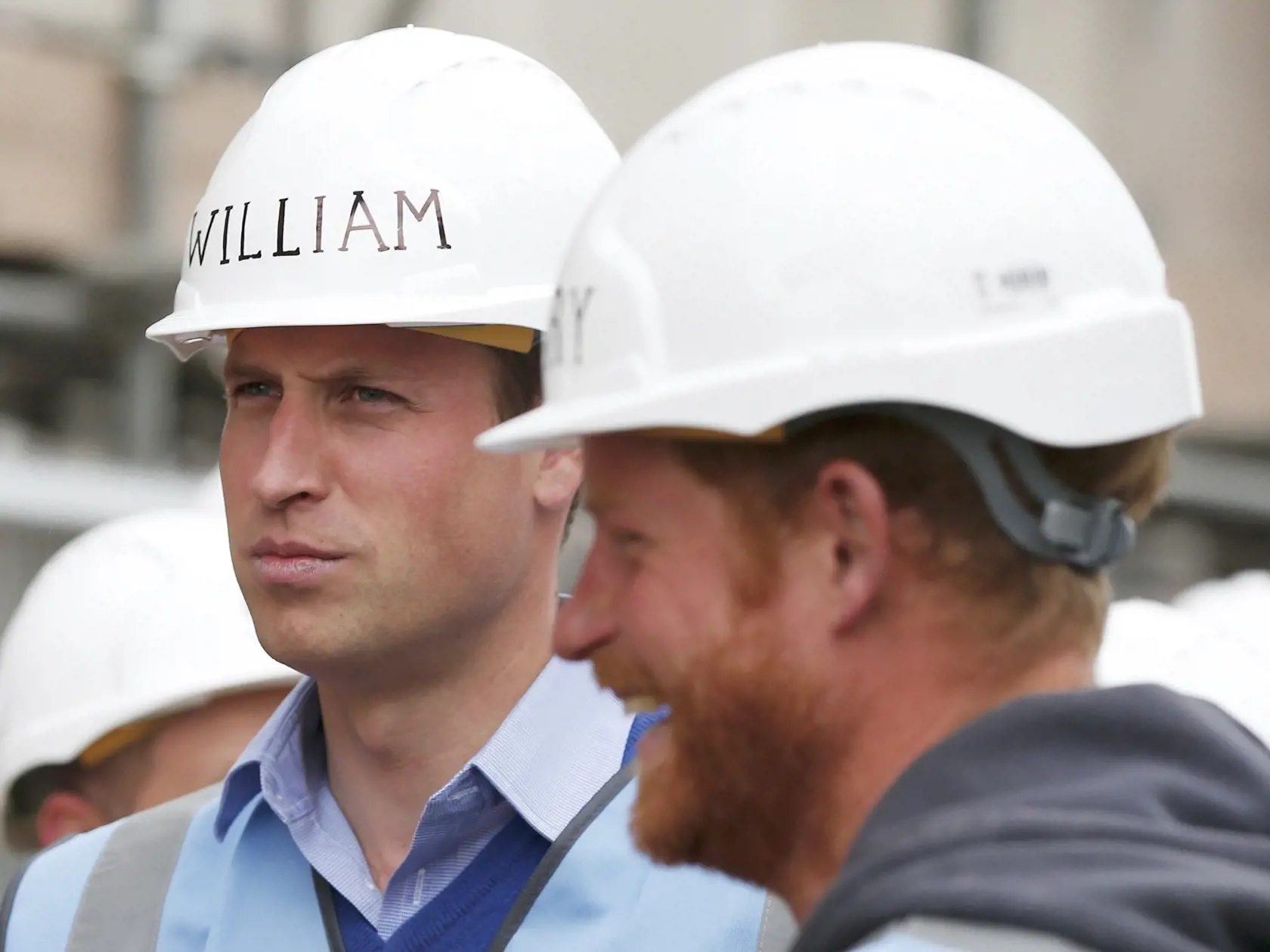 Britain's Prince William paints a wall during a visit to Manchester