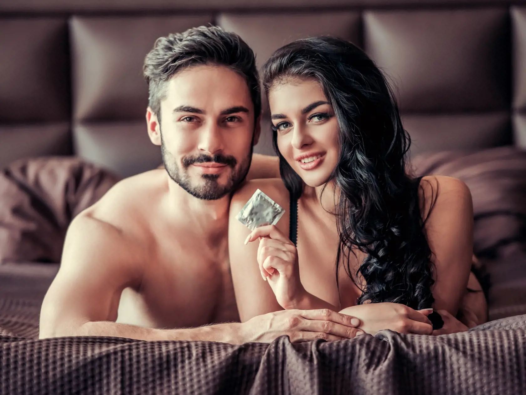 Sexy,Young,Couple,Is,Looking,At,Camera,And,Smiling,While