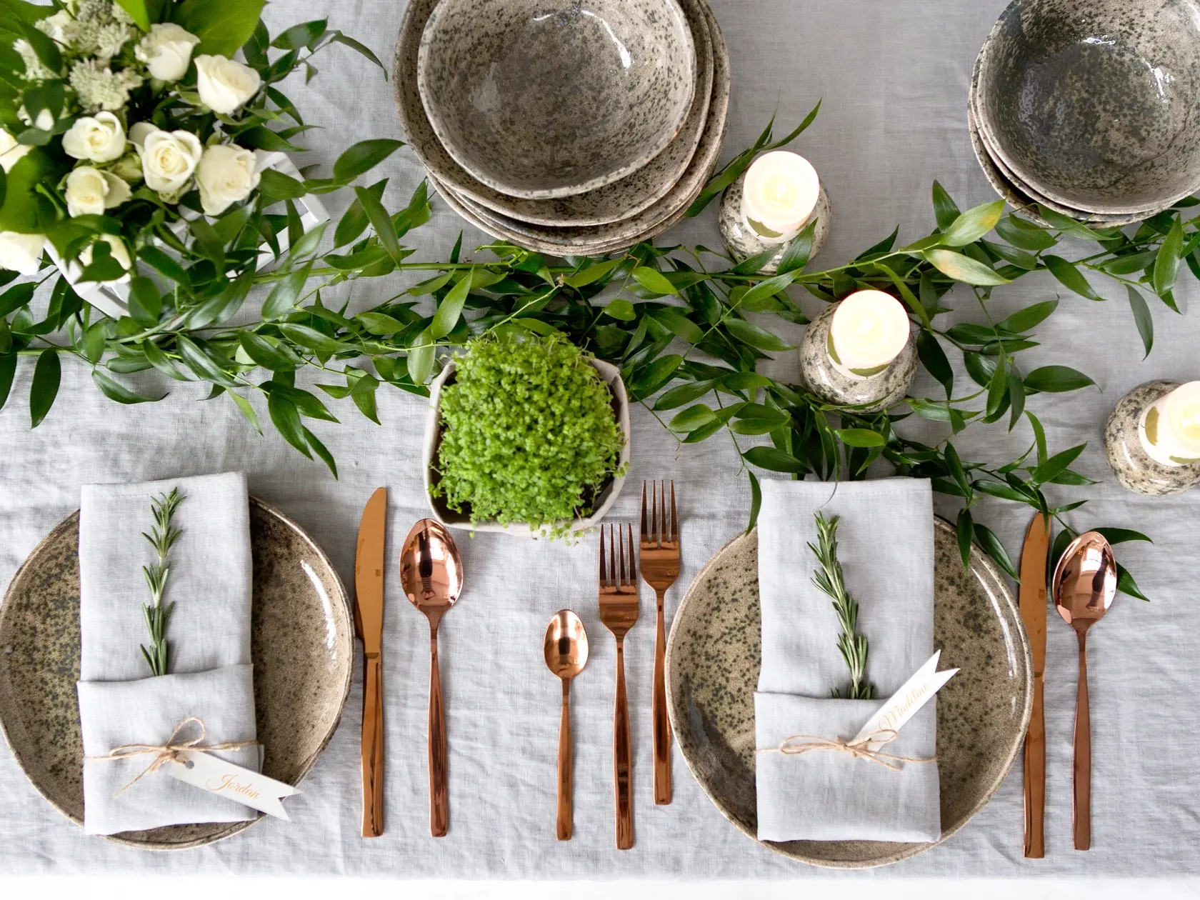 Holiday,Table,Setting,With,Linen,Napkins,And,Rose,Gold,Cutlery.