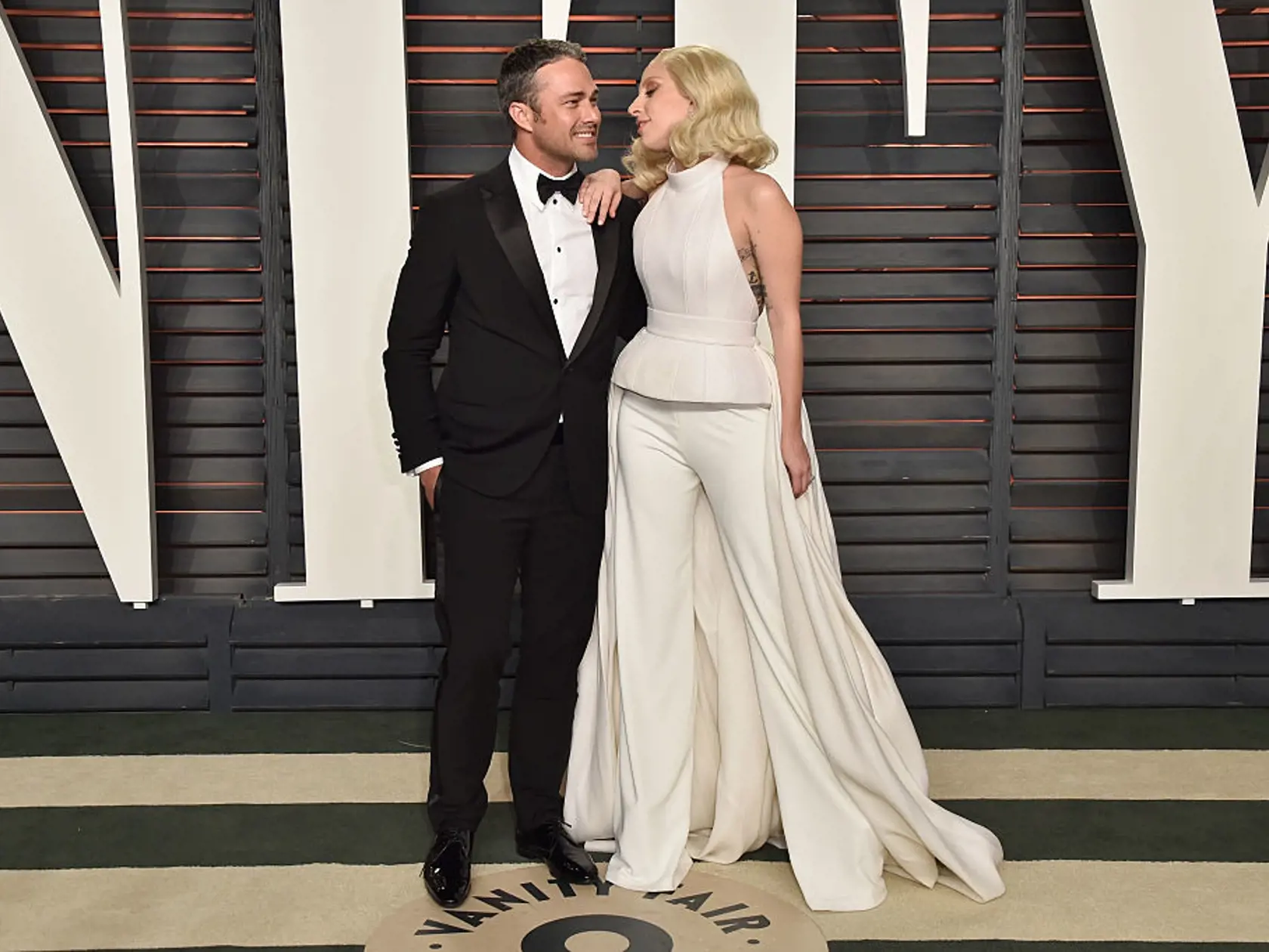 BEVERLY HILLS, CA - FEBRUARY 28:  Actor Taylor Kinney and recording artist Lady Gaga attend the 2016 Vanity Fair Oscar Party Hosted By Graydon Carter at the Wallis Annenberg Center for the Performing Arts on February 28, 2016 in Beverly Hills, California.  (Photo by Pascal Le Segretain/Getty Images)