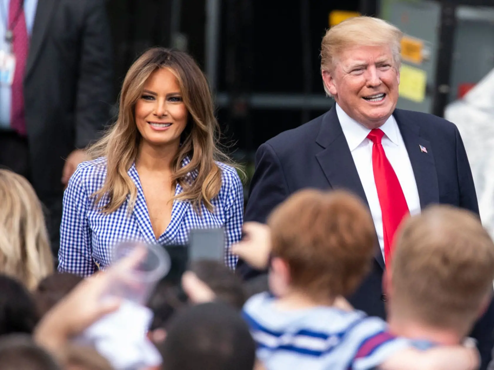 WASHINGTON, DC - JULY 04: US President Donald Trump and first lady Melania Trump walk on the South Lawn of the White House prior to greeting guests during a picnic for military families on at the White House on July 4, 2018 in Washington, DC. (Photo by Alex Edelman/Getty Images)