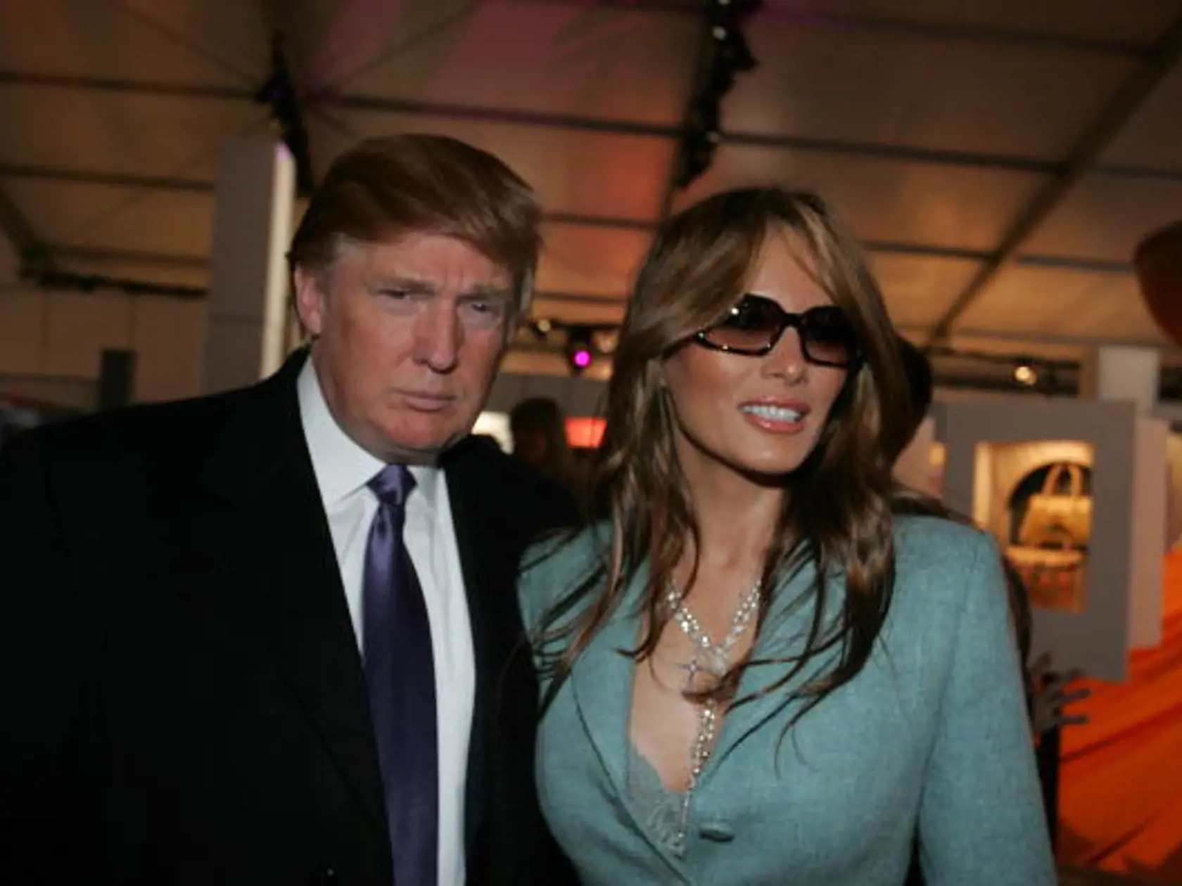 NEW YORK - FEBRUARY 09:  Donald and Melania Trump pose for photos in the lobby of the main tent during Olympus Fashion Week Fall 2005 at Bryant Park February 9, 2005 in New York City. (Photo by Katy Winn/Getty Images)
