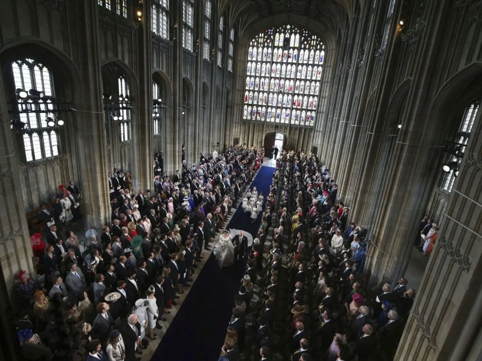 Princess Eugenie of York walks down the aisle with her father, the Duke of York, for her wedding to Jack Brooksbank in St Georgeâs Chapel, Windsor Castle, near London, England, Friday Oct. 12, 2018. (Yui Mok, Pool via AP)