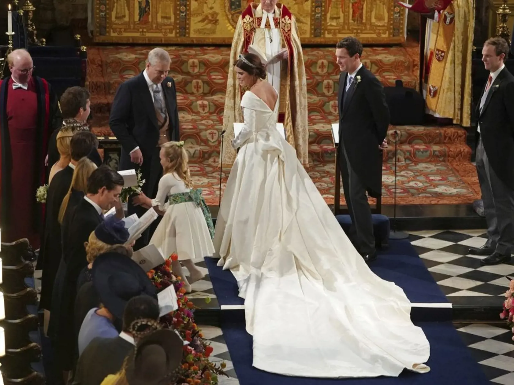 The Duke of York and and Princess Eugenie of York arrive for her wedding to Jack Brooksbank, second right, in St Georgeâs Chapel, Windsor Castle, near London, England, Friday Oct. 12, 2018. (Owen Humphreys, Pool via AP)