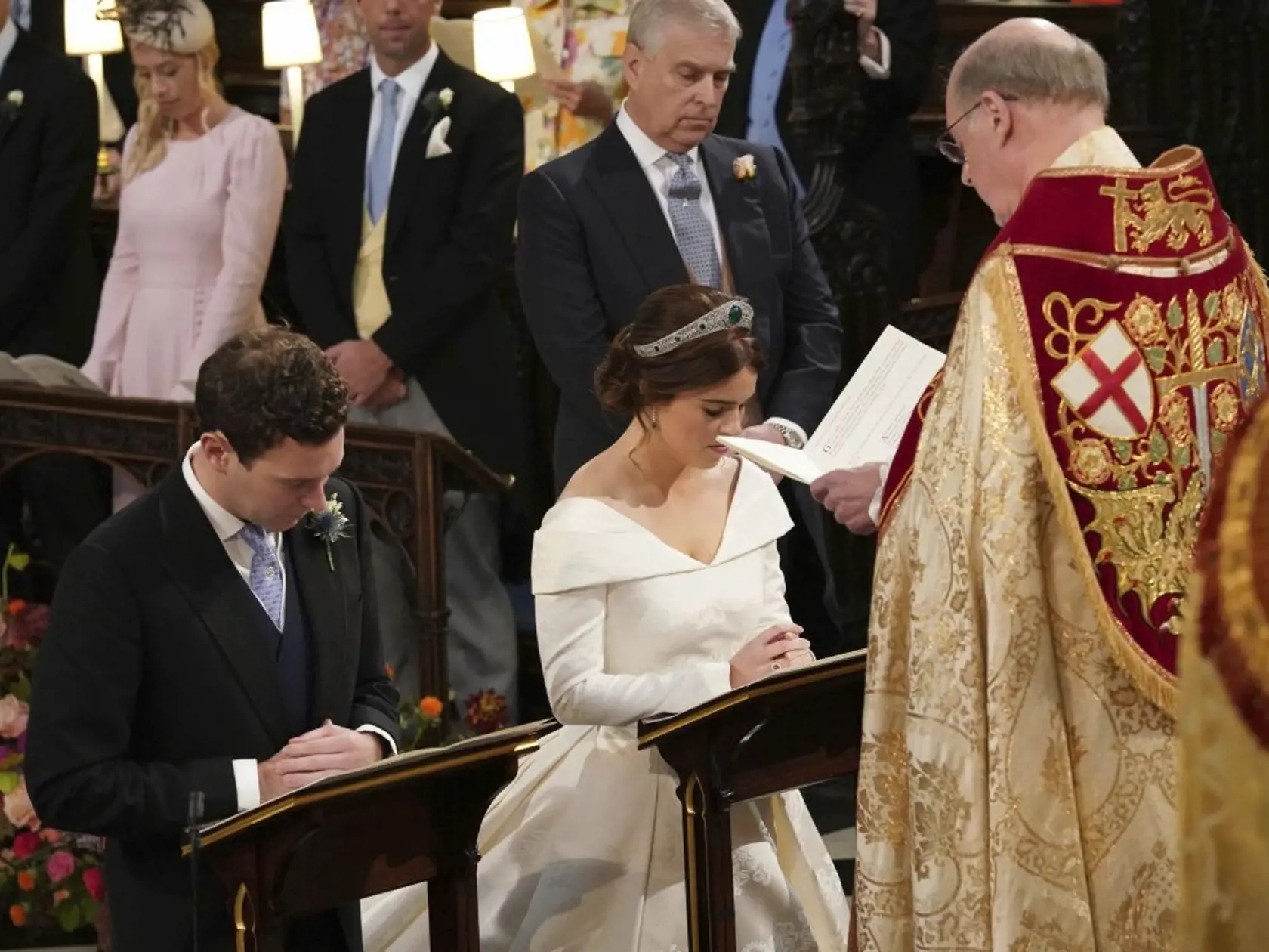 The Rt Revd David Conner, Dean of Windsor conducts the wedding ceremony between Princess Eugenie of York and Jack Brooksbank in St Georgeâs Chapel, Windsor Castle, near London, England, Friday Oct. 12, 2018. (Jonathan Brady, Pool via AP)